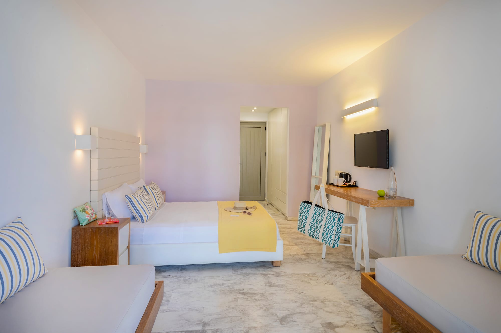 a room with a bed and a television