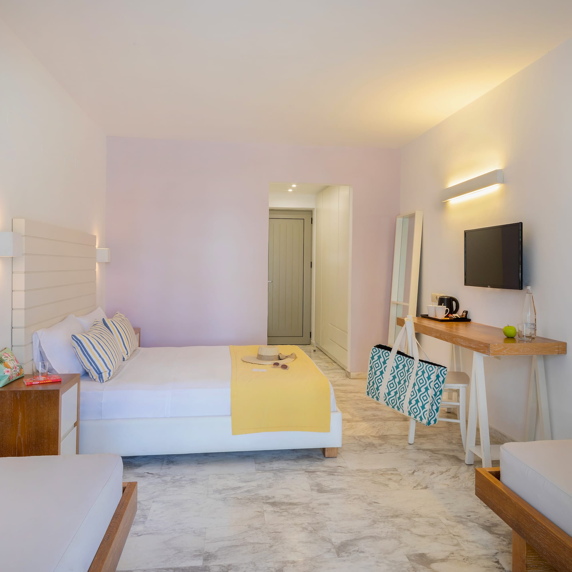 a room with a bed and a television