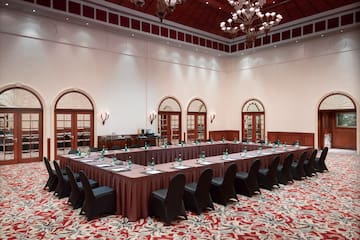 a long table with chairs in a room