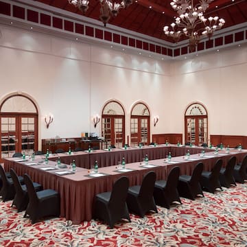 a long table with chairs in a room