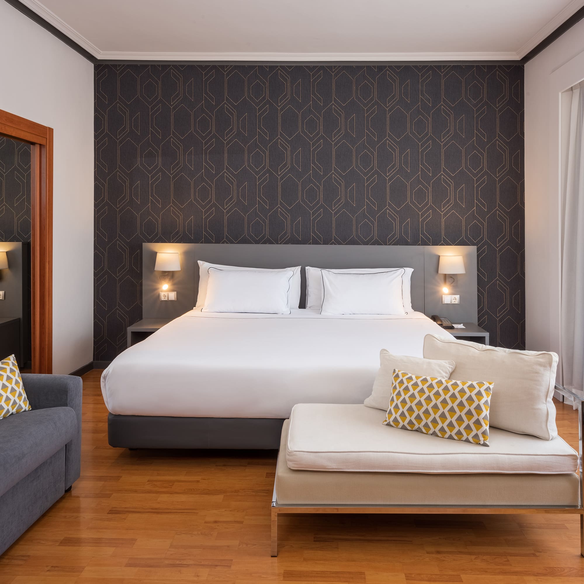 a bedroom with a bed and a couch