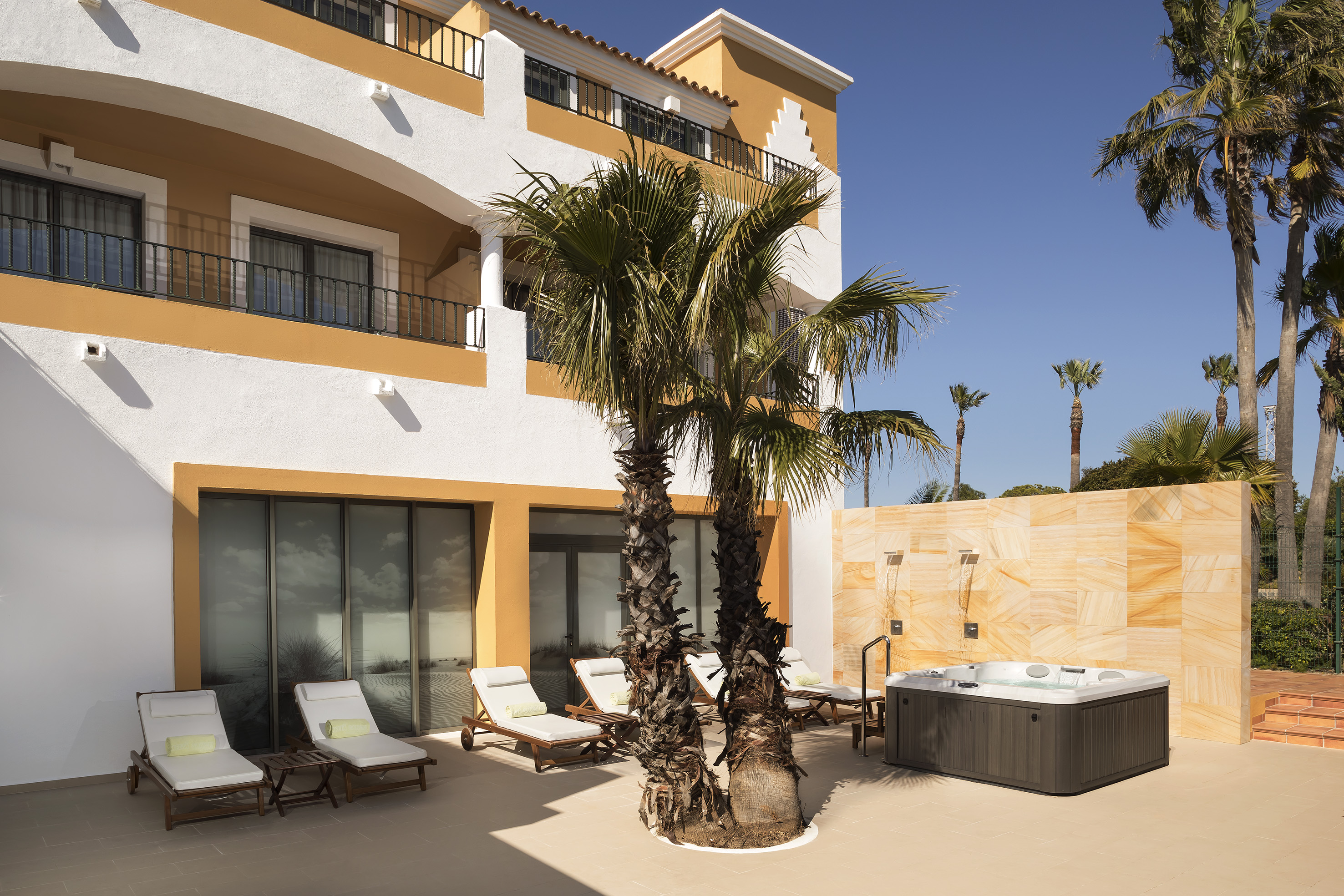 a palm trees next to a building