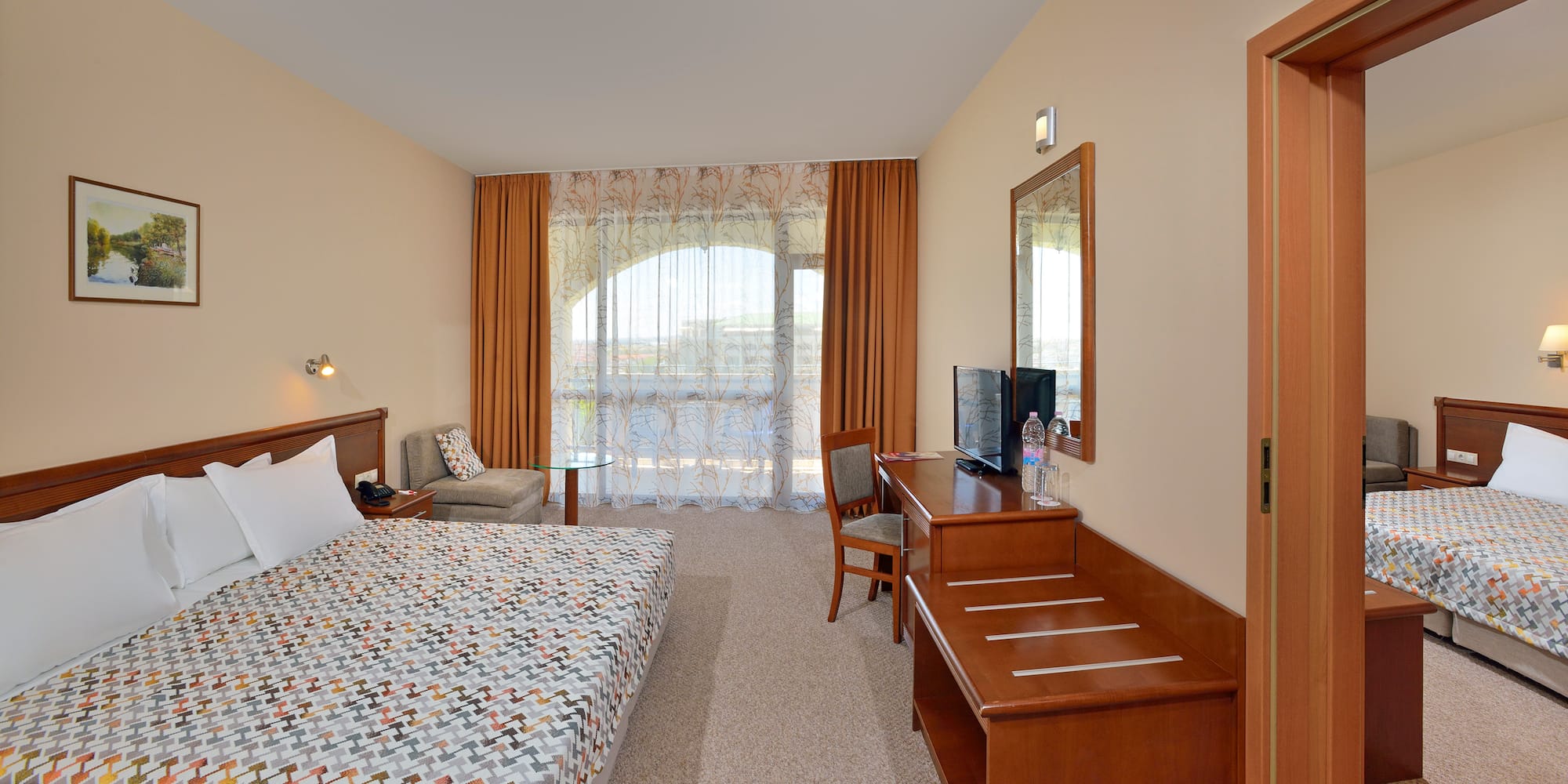 a room with a bed and a desk