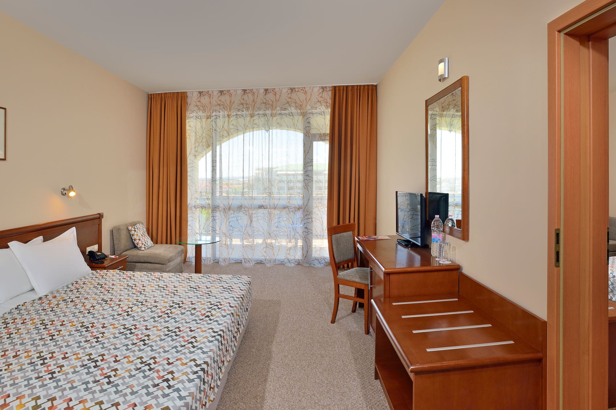 a room with a bed and a desk