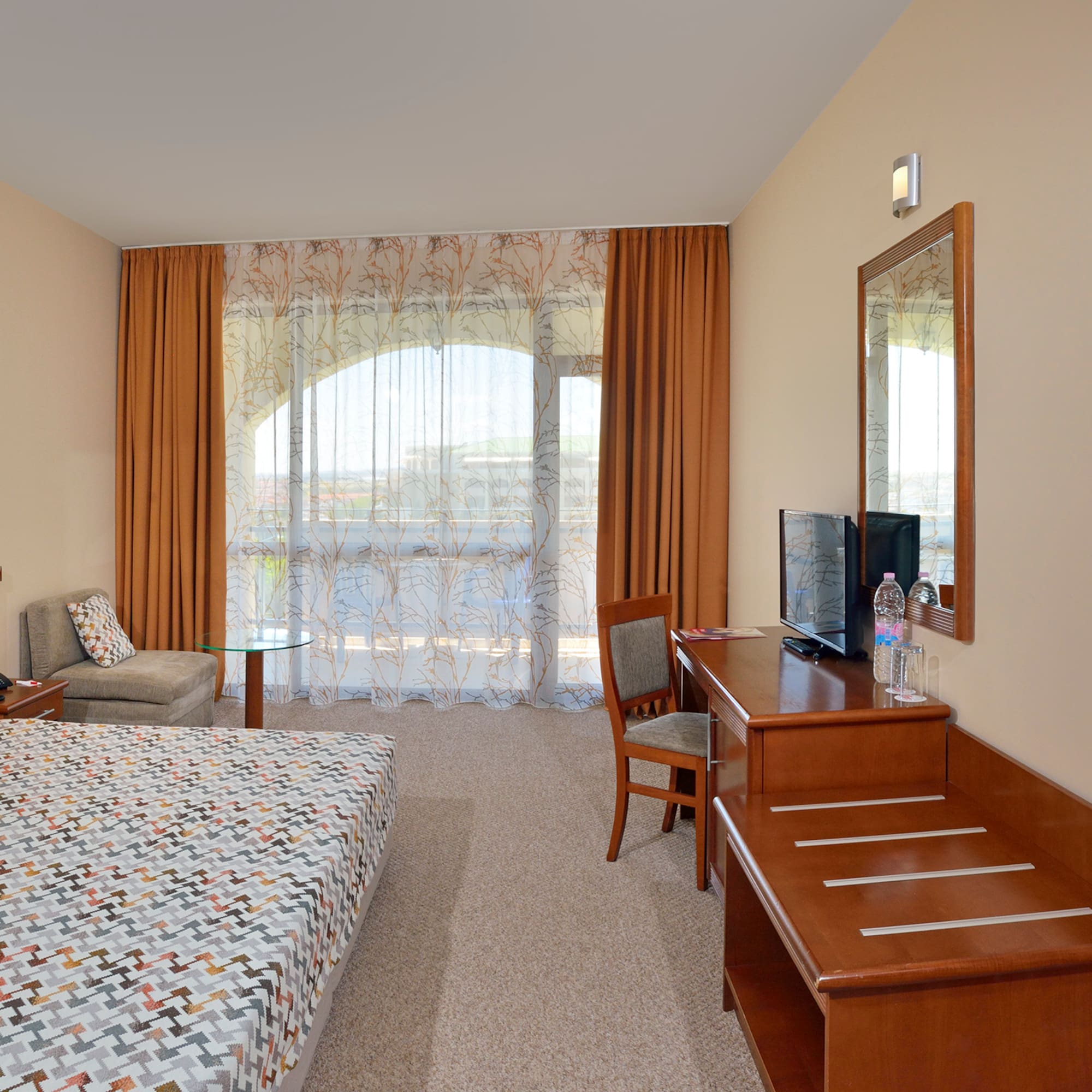 a room with a bed and a desk