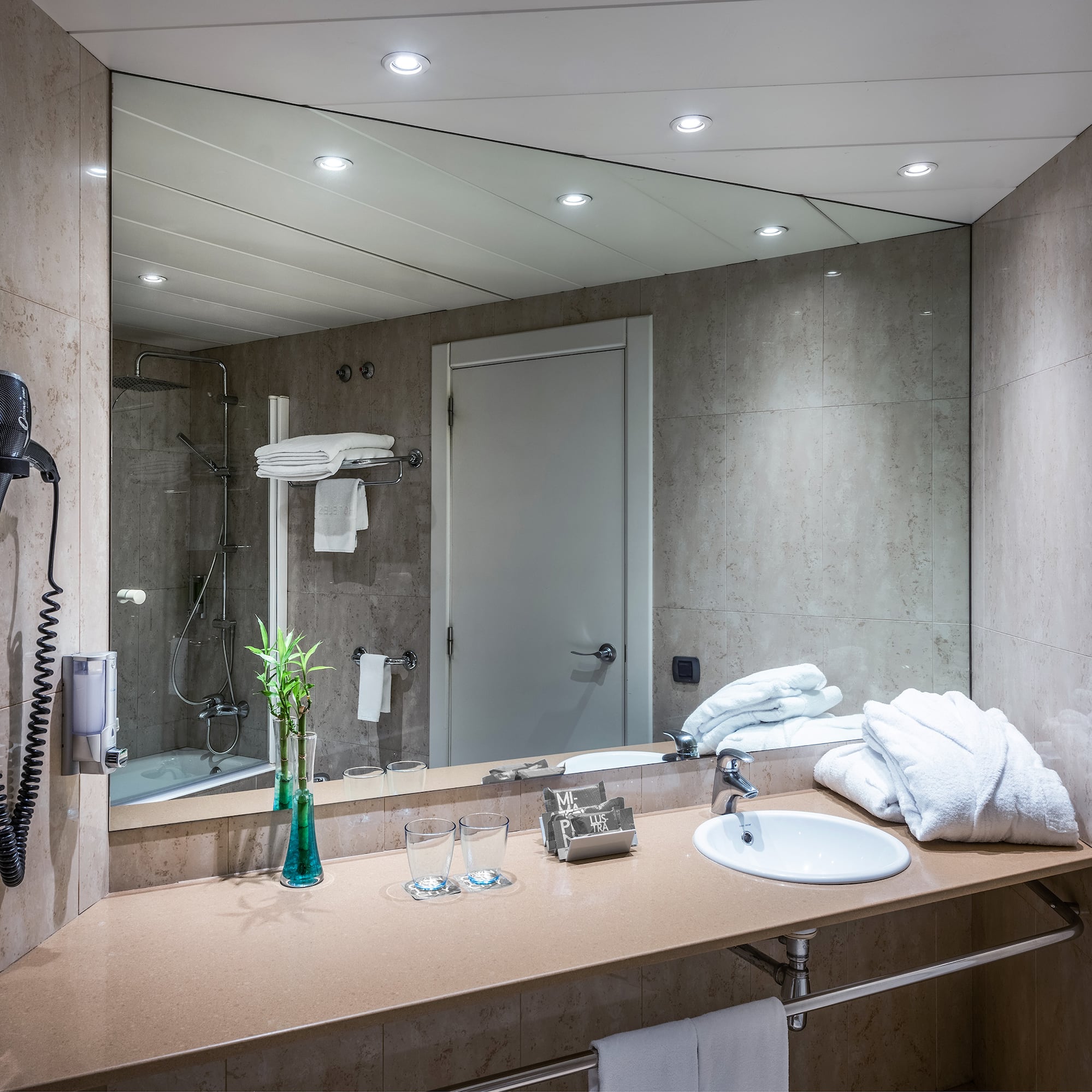a bathroom with a mirror and sink