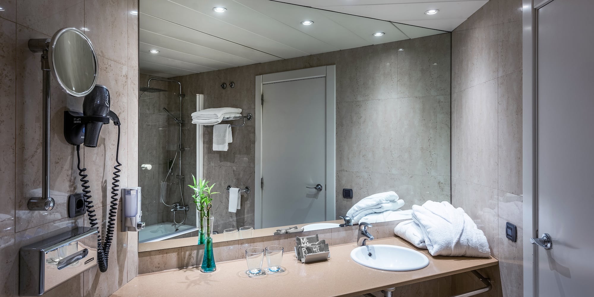 a bathroom with a mirror and sink