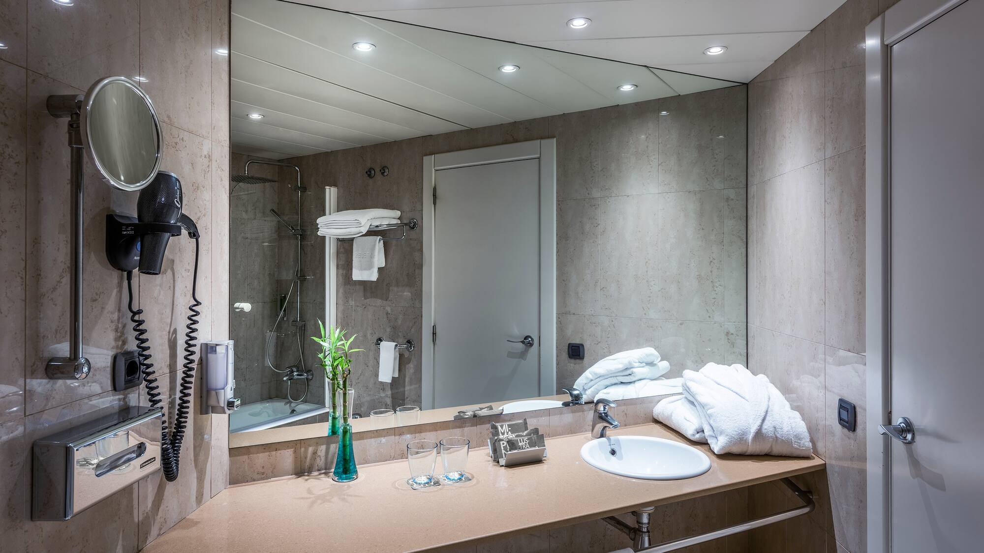 a bathroom with a mirror and sink