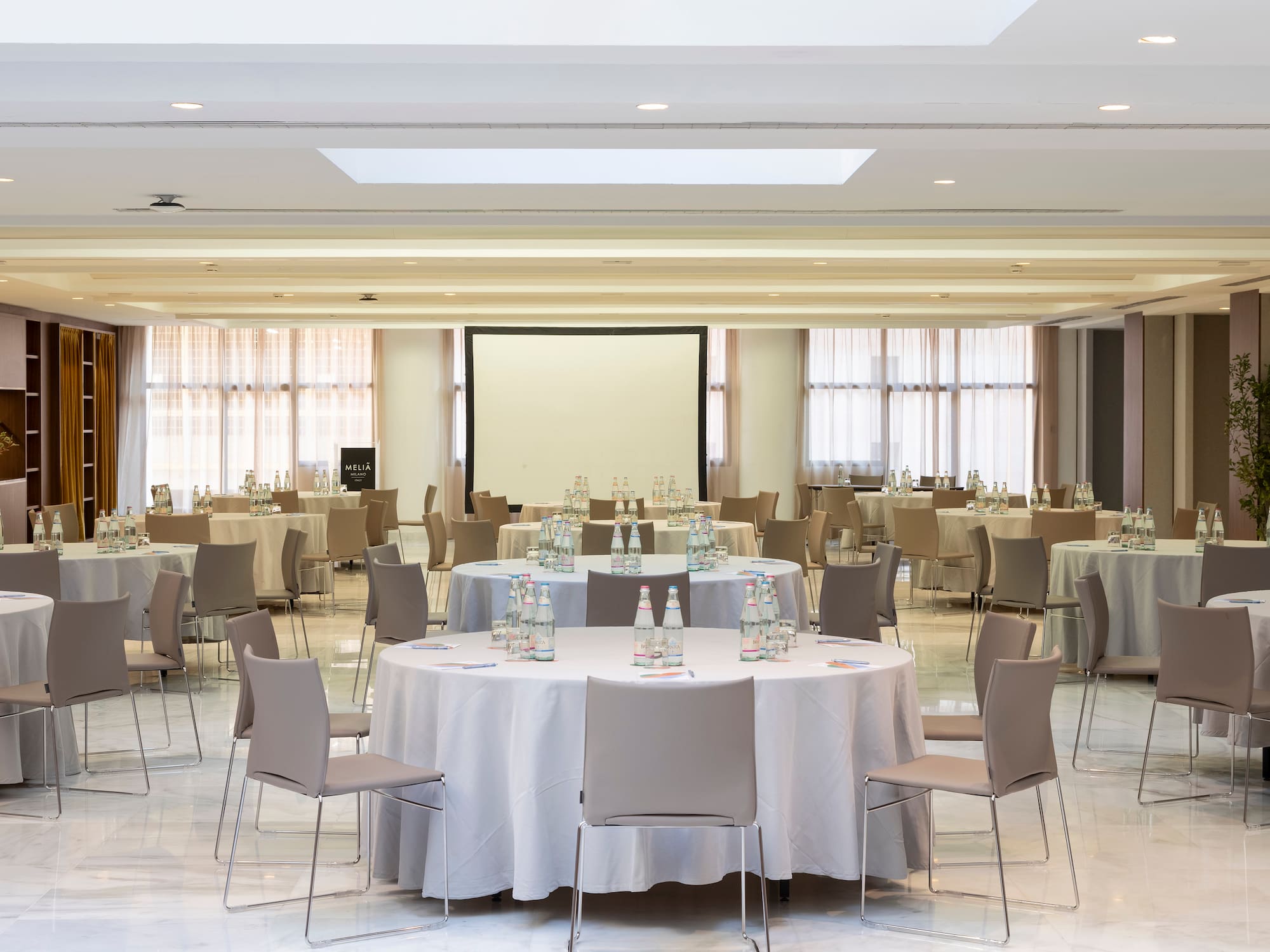 a room with tables and chairs