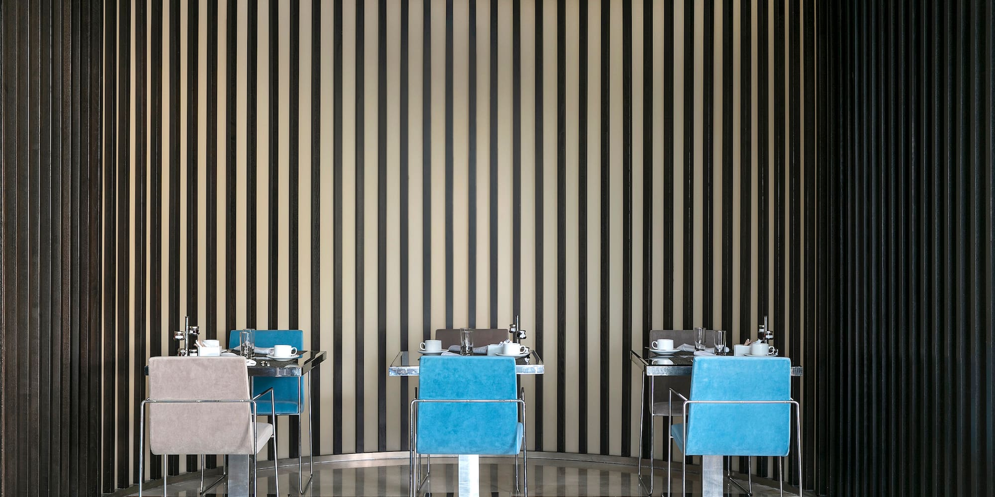 a room with chairs and tables