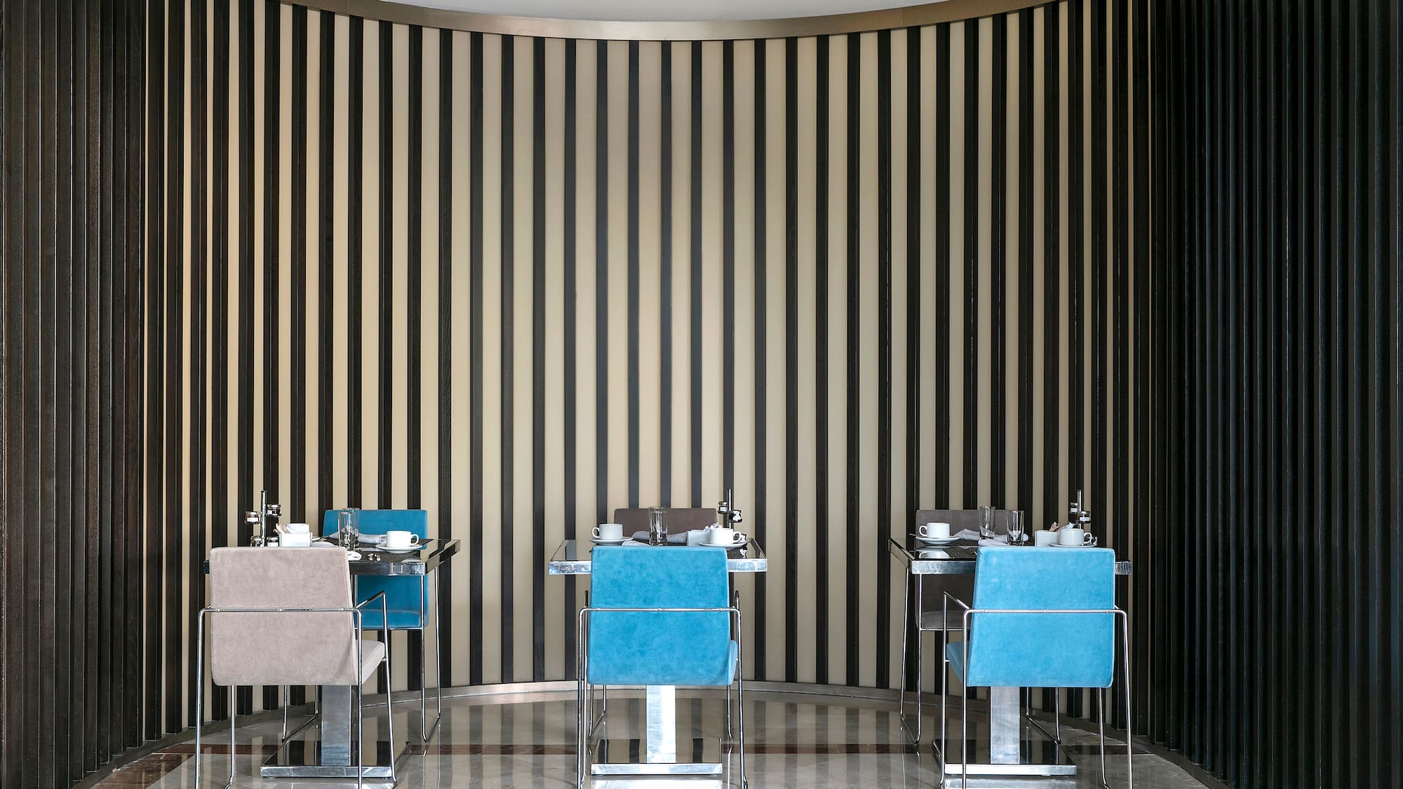 a room with chairs and tables