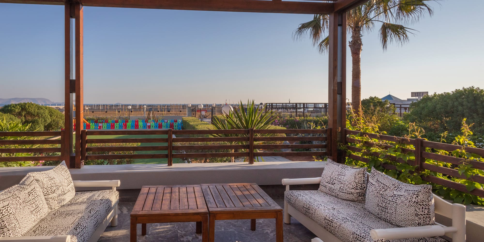 a patio with a table and chairs