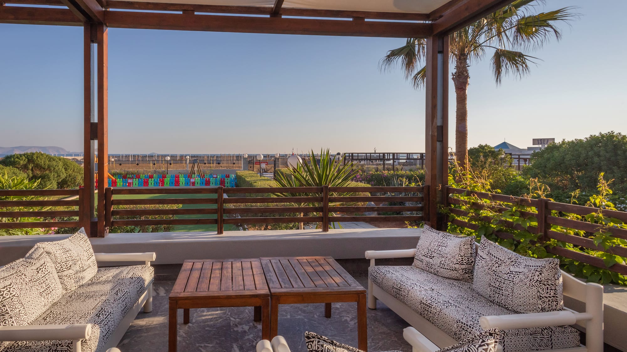 a patio with a table and chairs