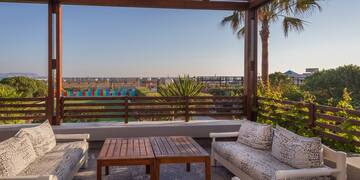 a patio with a table and chairs