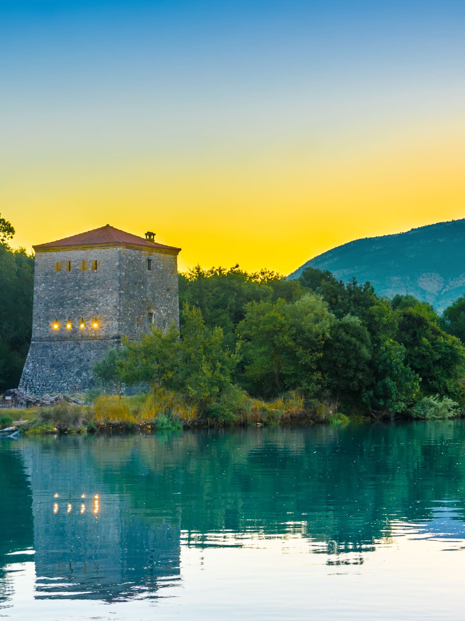 a building next to a body of water