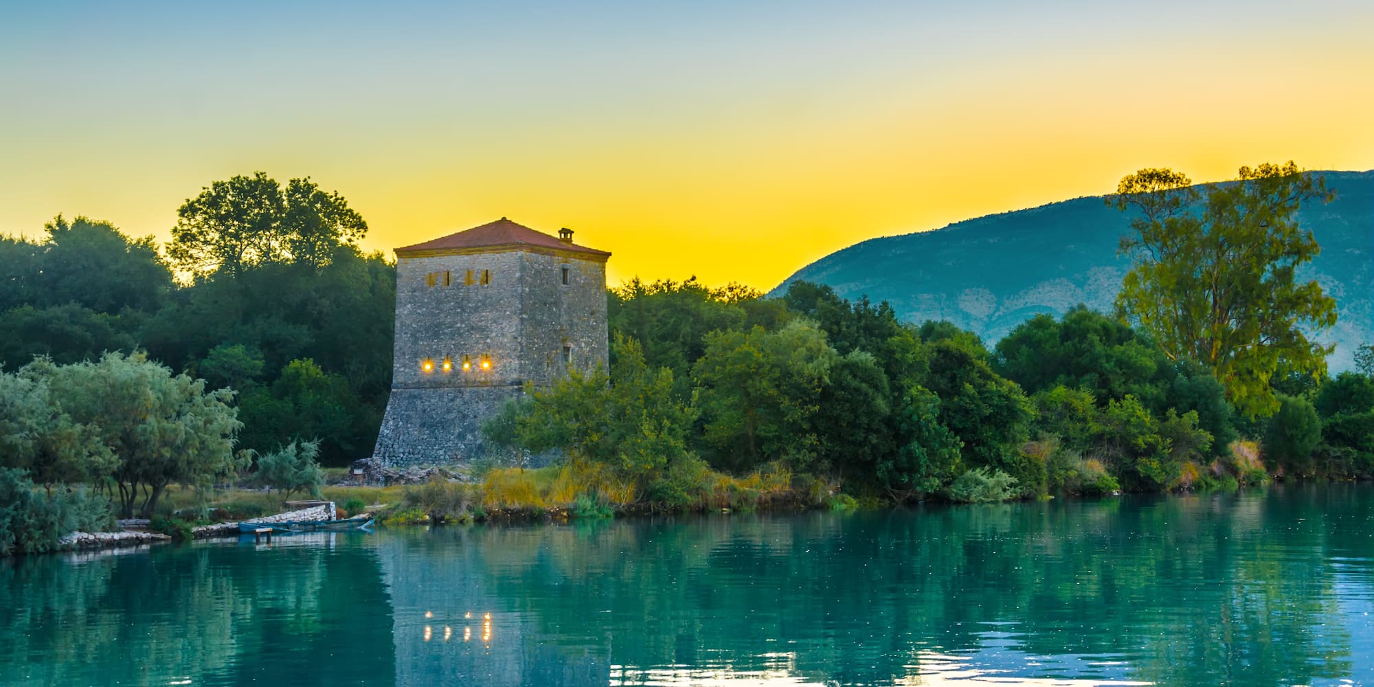 a building next to a body of water