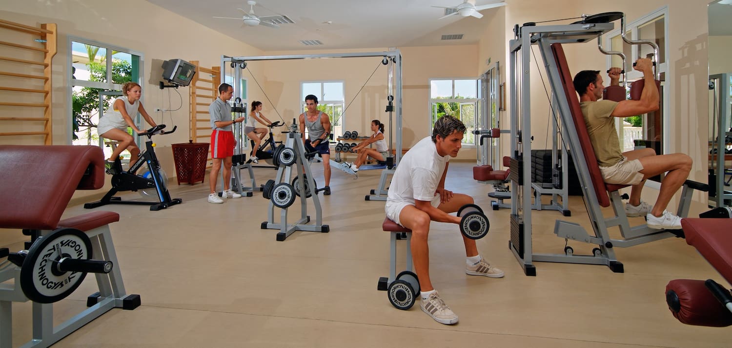 a group of people working out in a gym