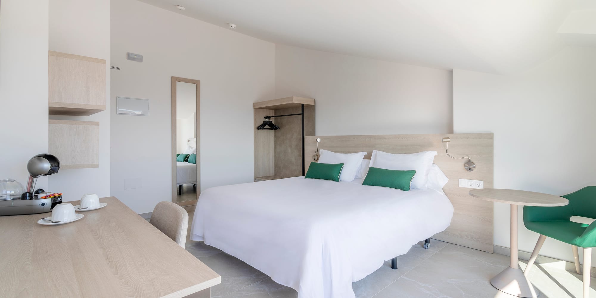 a bedroom with a bed and a desk