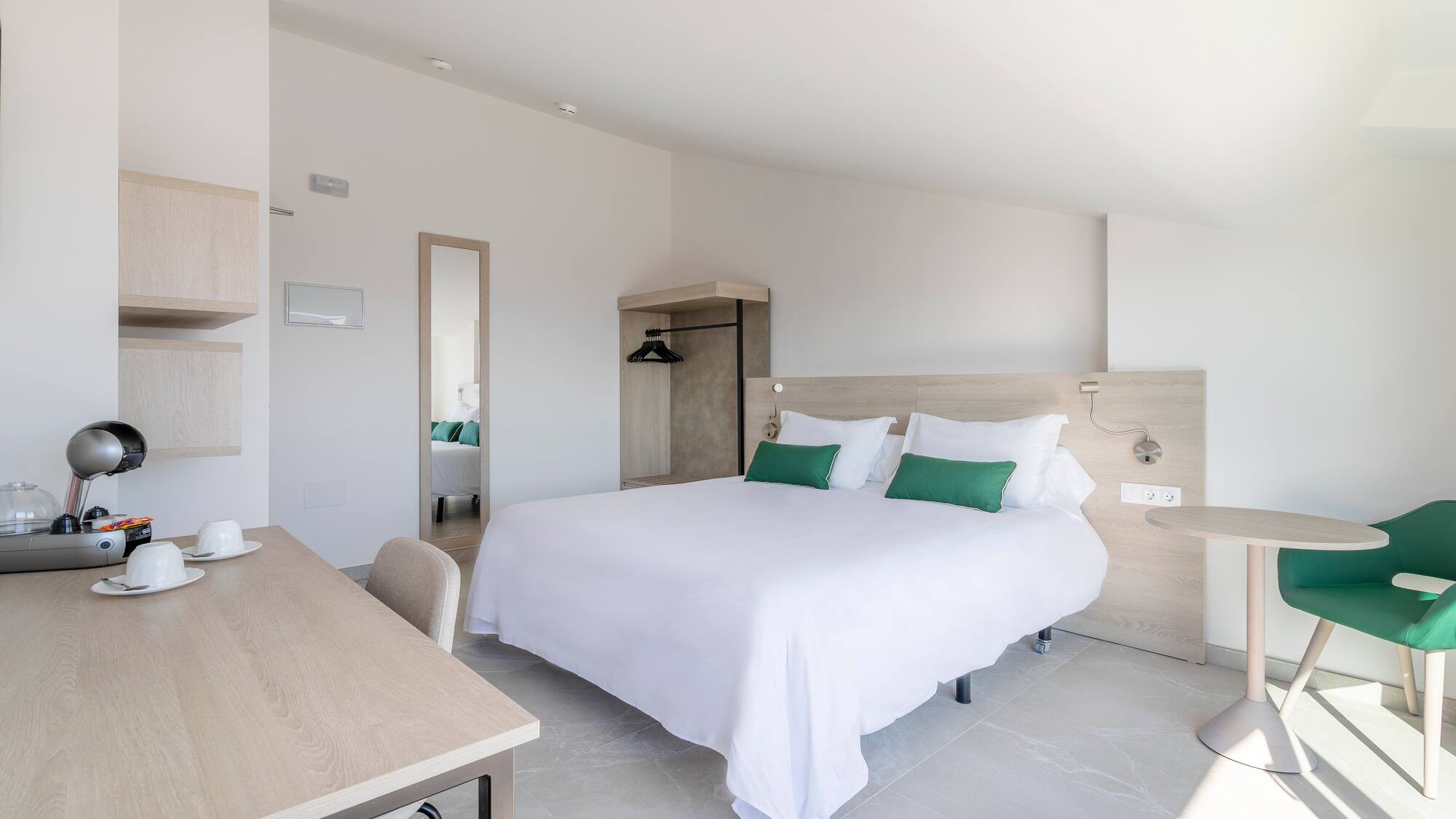 a bedroom with a bed and a desk