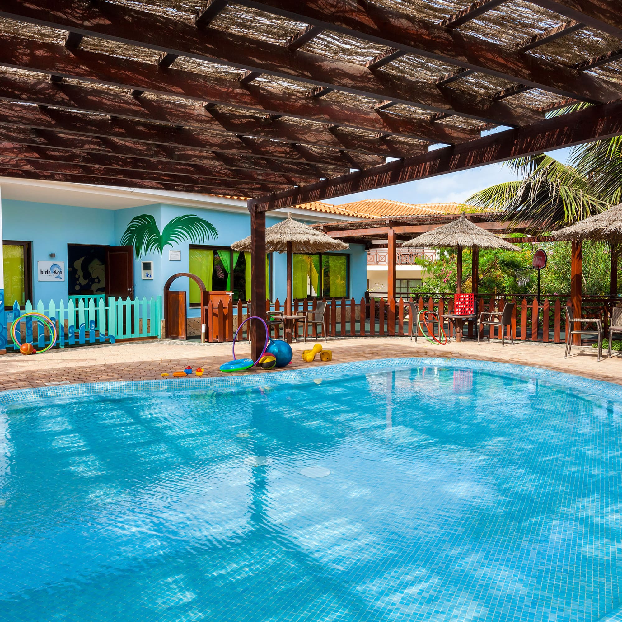 a pool with a wooden roof