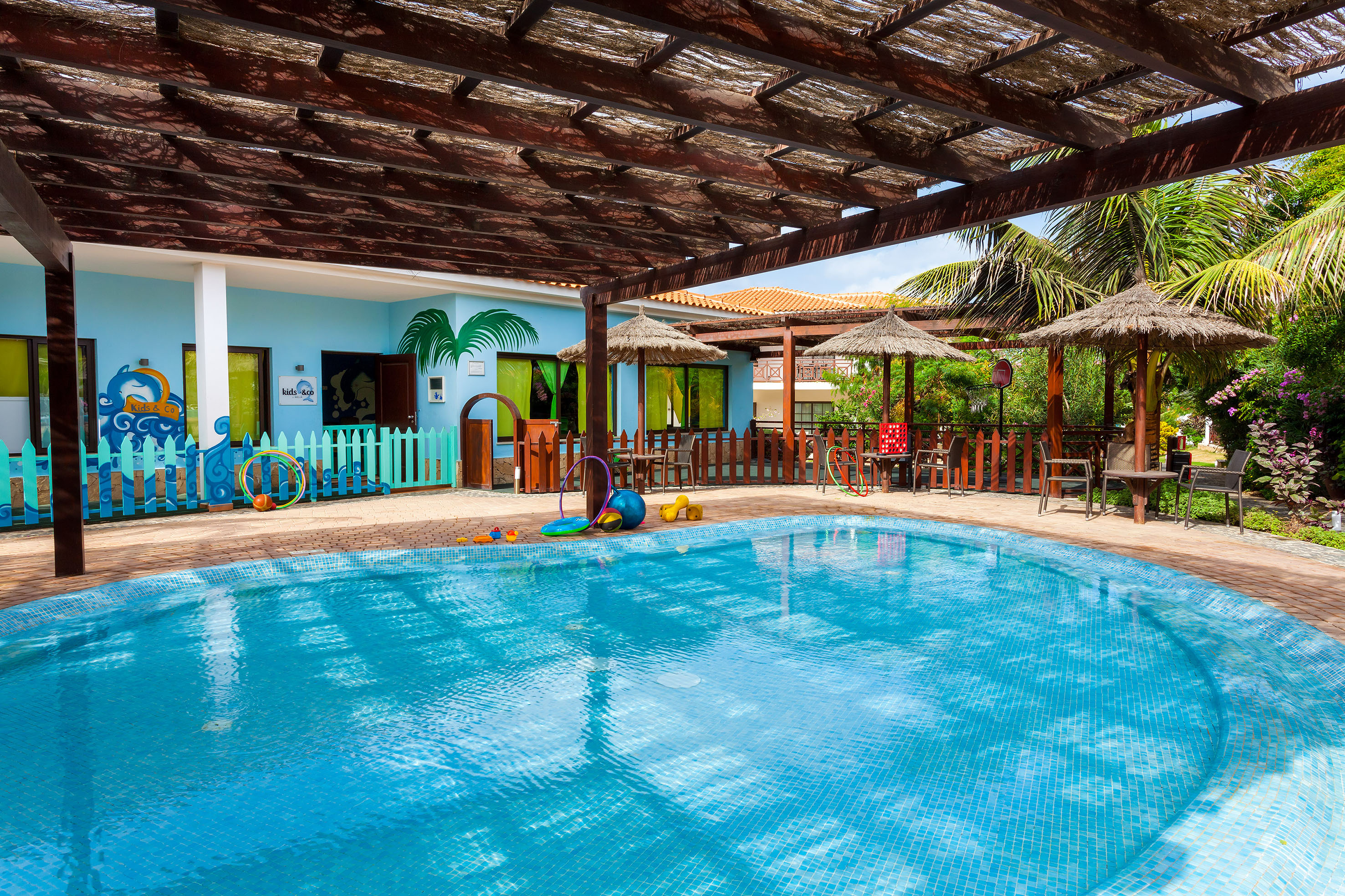 a pool with a wooden roof