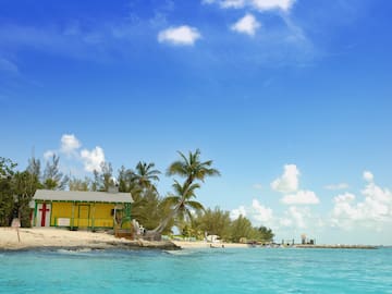 a yellow building on a beach