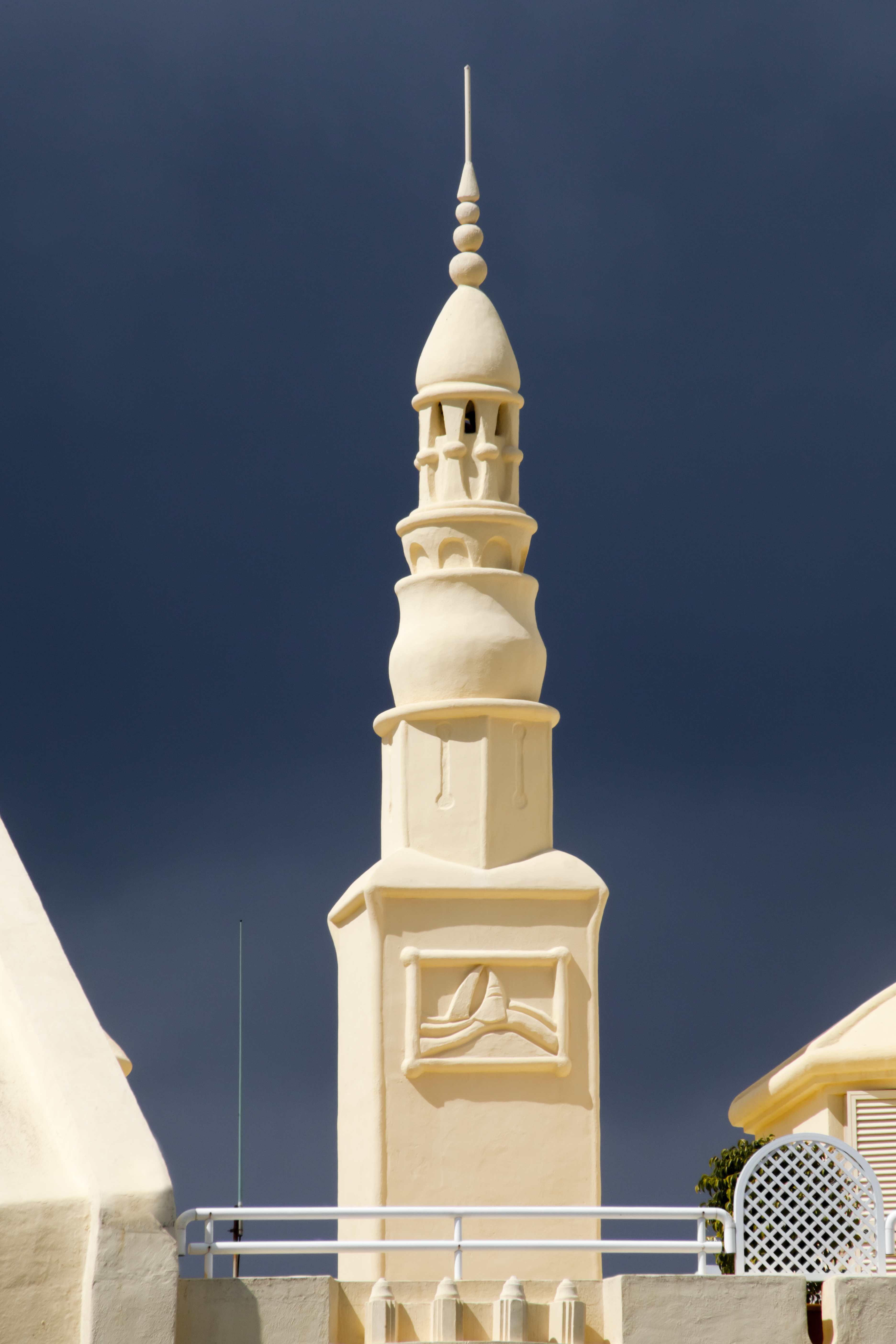 a white tower with a pointy top