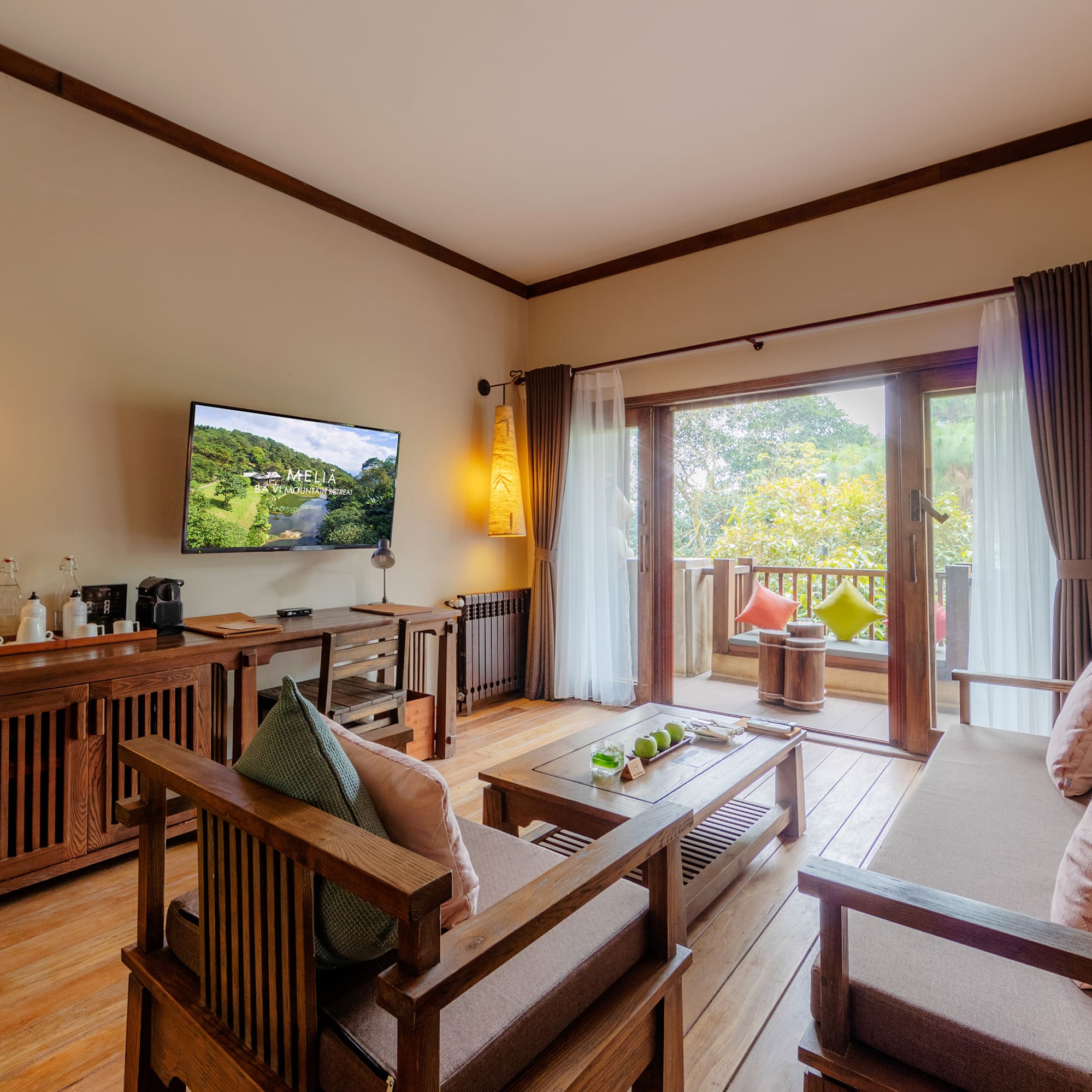 a living room with a television and a television on the wall
