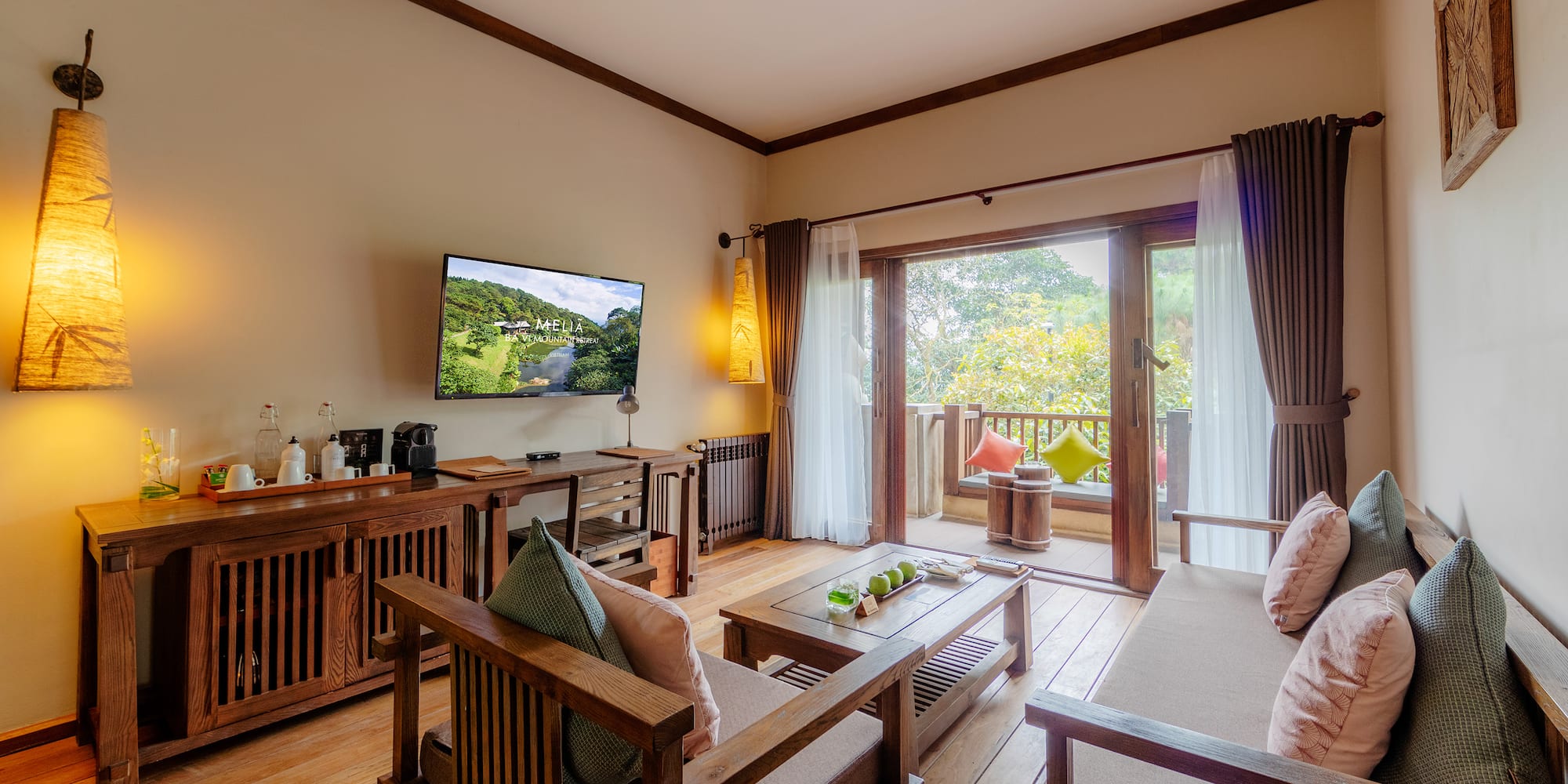 a living room with a television and a television on the wall
