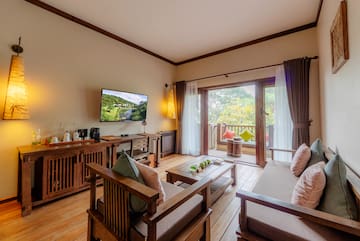 a living room with a television and a television on the wall