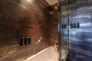 a bathroom with a shower and bathtub