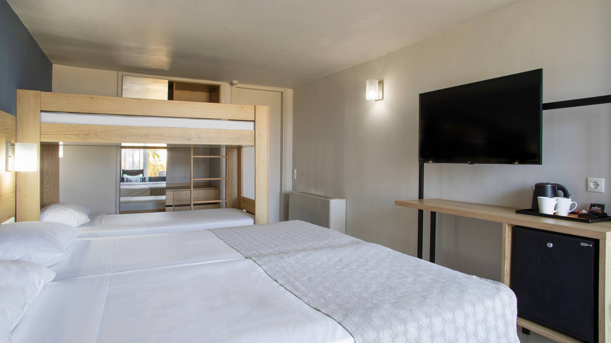 a room with a tv and a bed