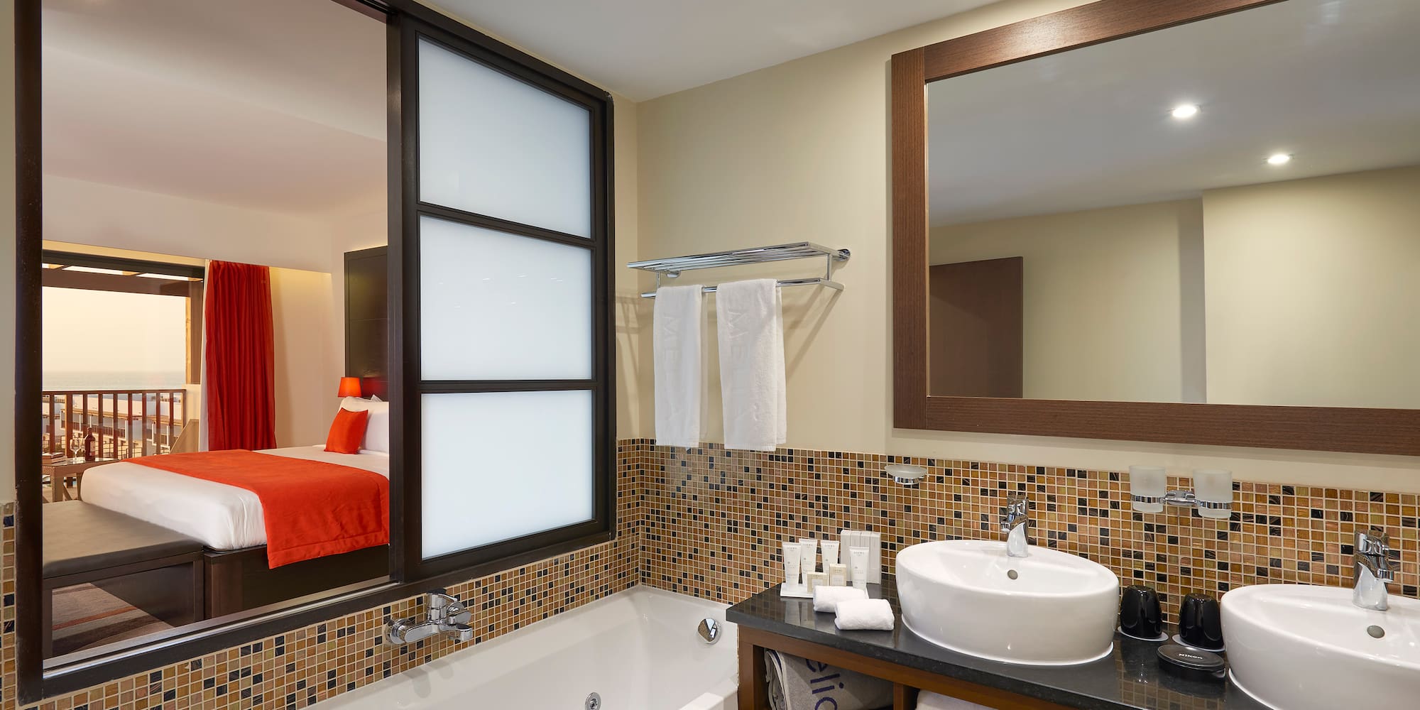 a bathroom with a bathtub and a mirror