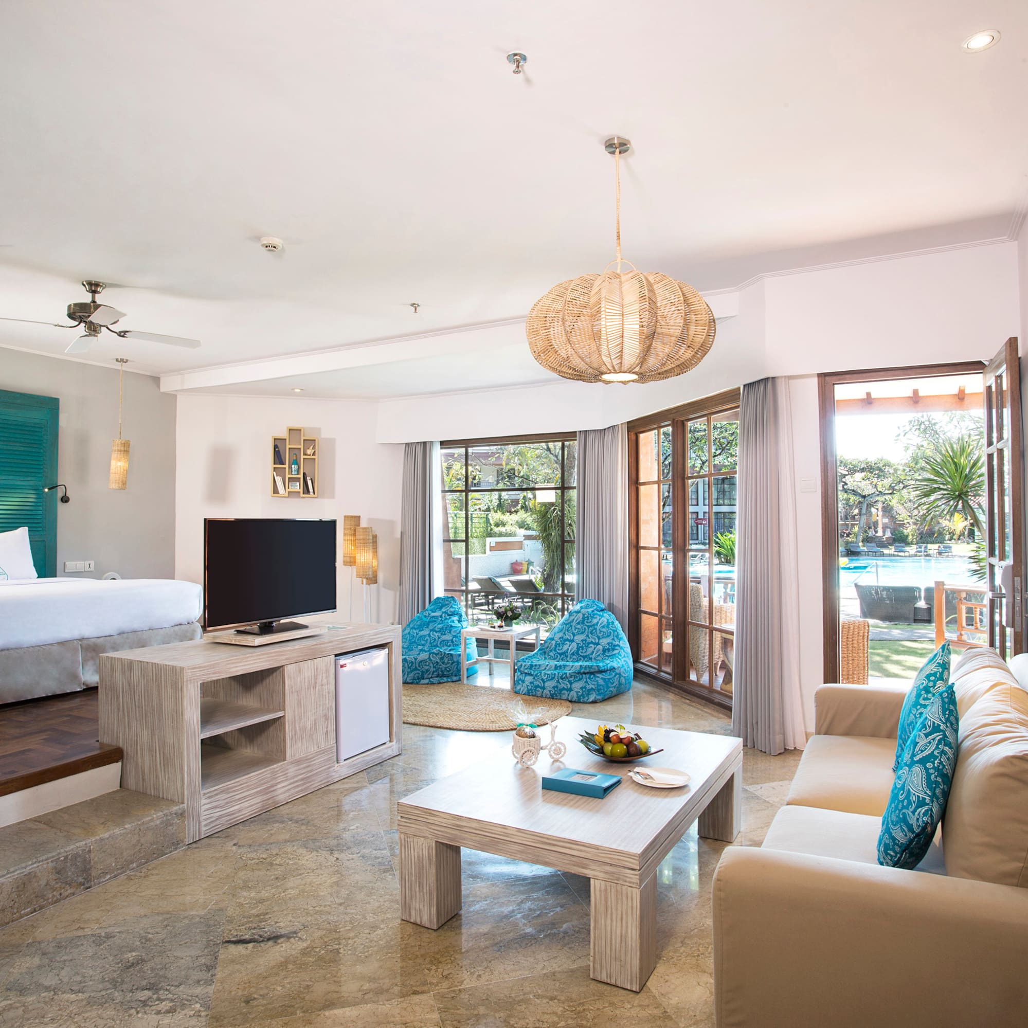 a room with a bed and a television