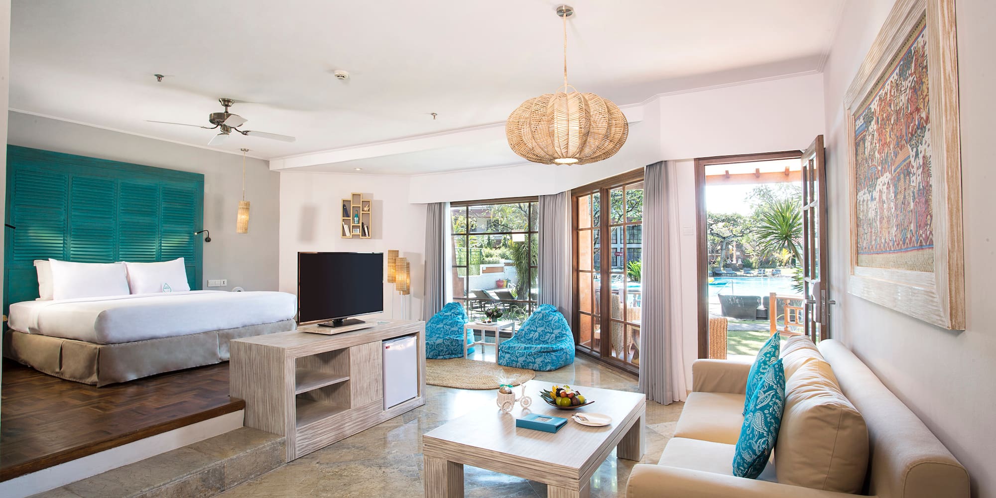 a room with a bed and a television