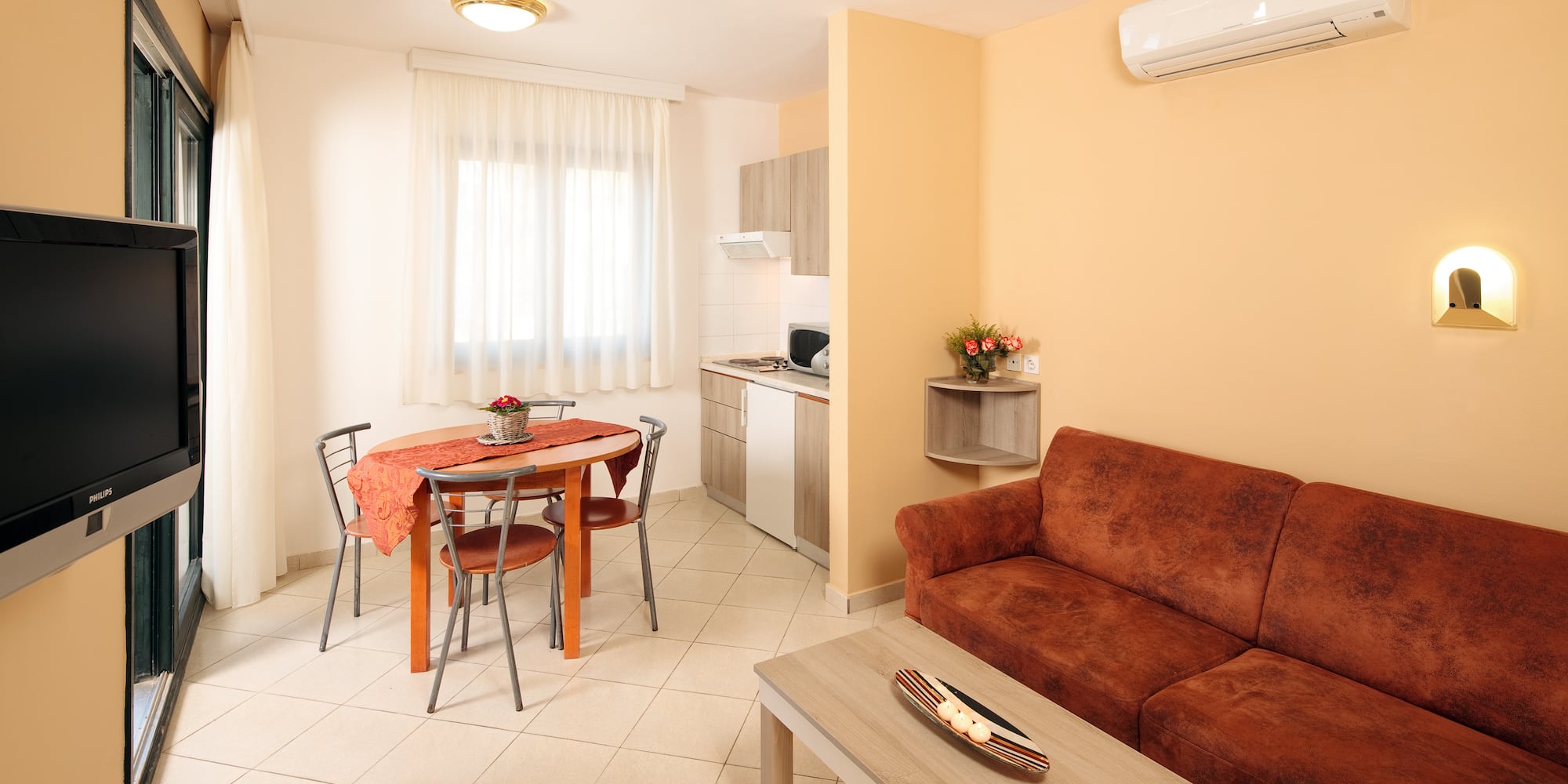 a living room with a couch and table