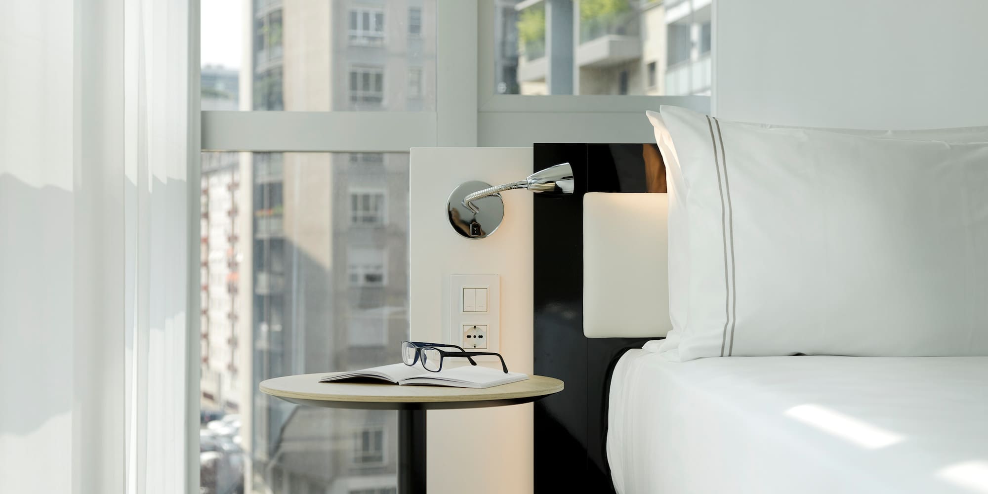 a table next to a bed