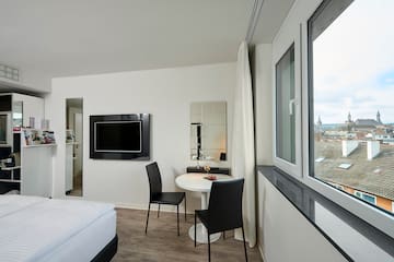 a room with a tv and a table