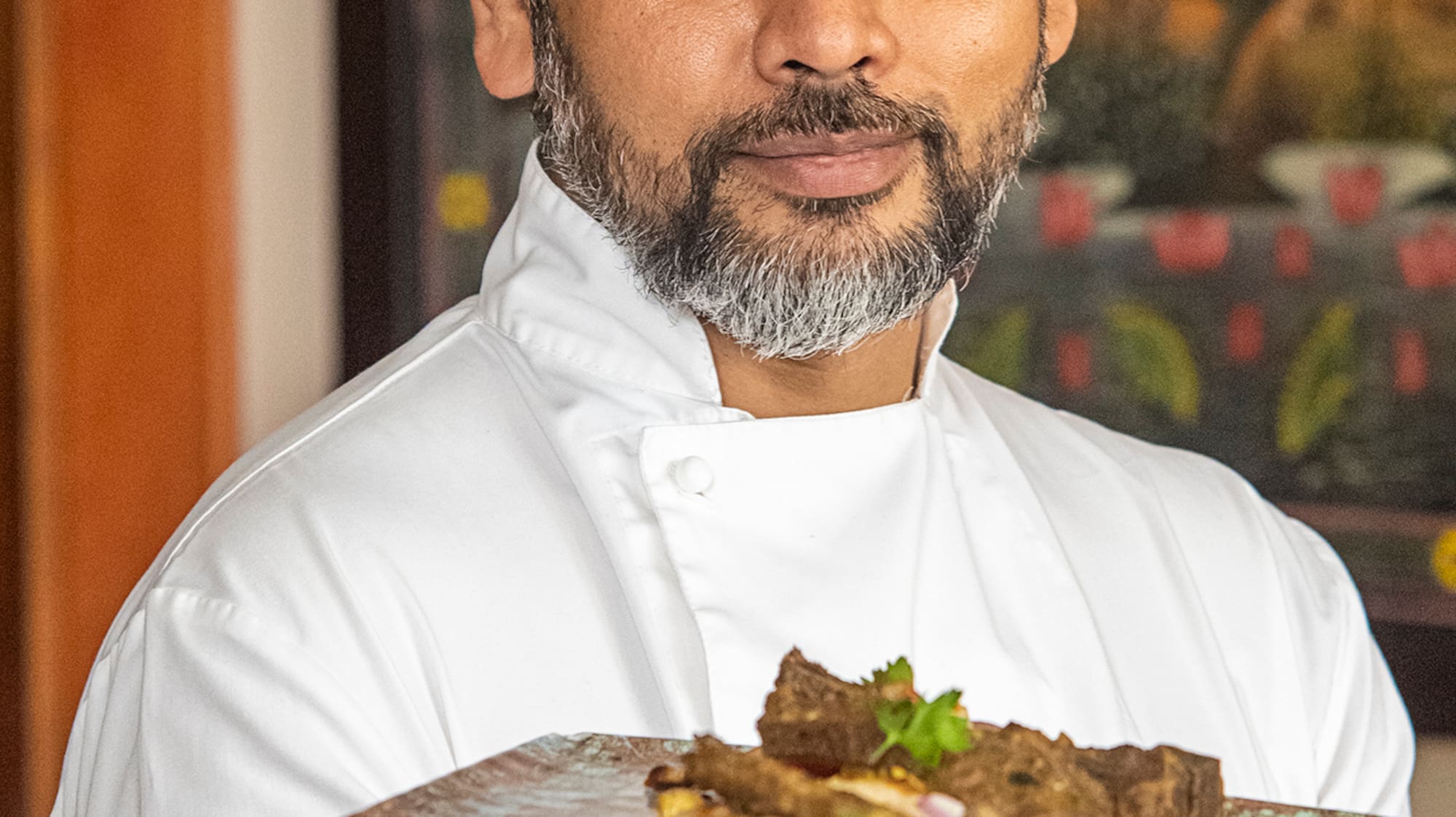 a man holding a plate of food