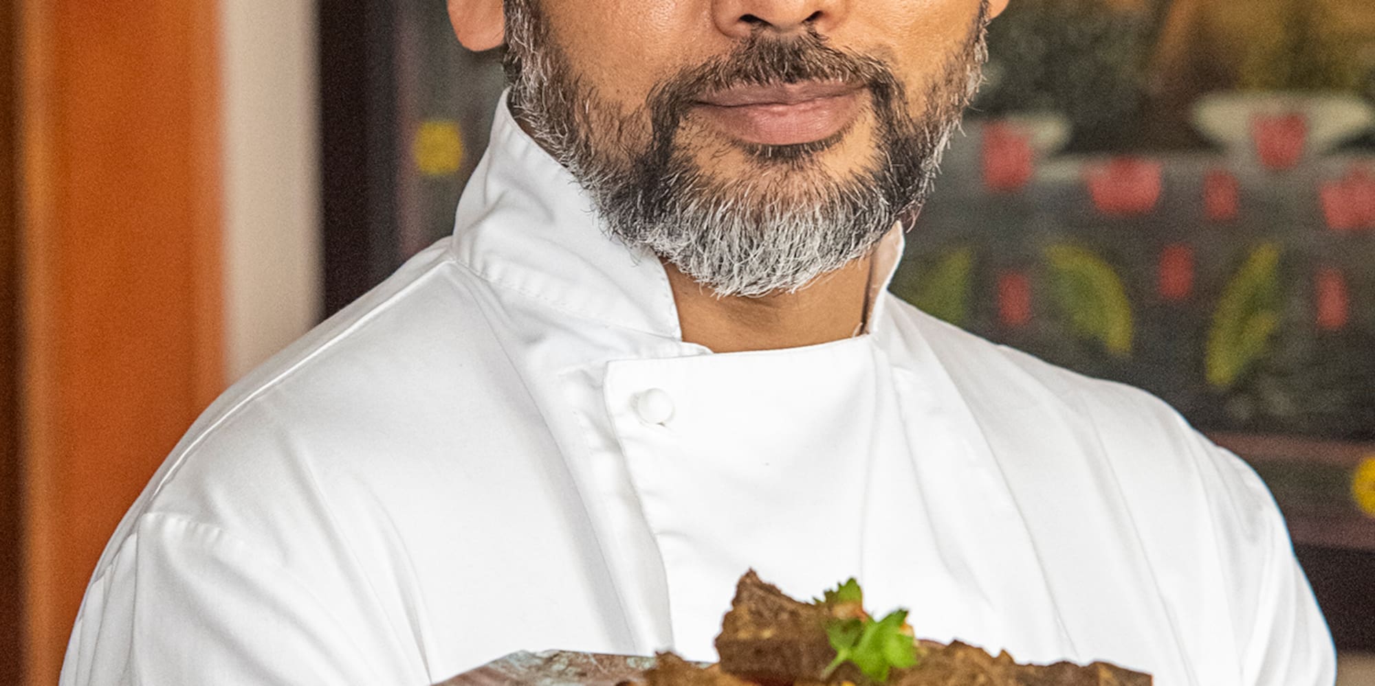 a man holding a plate of food