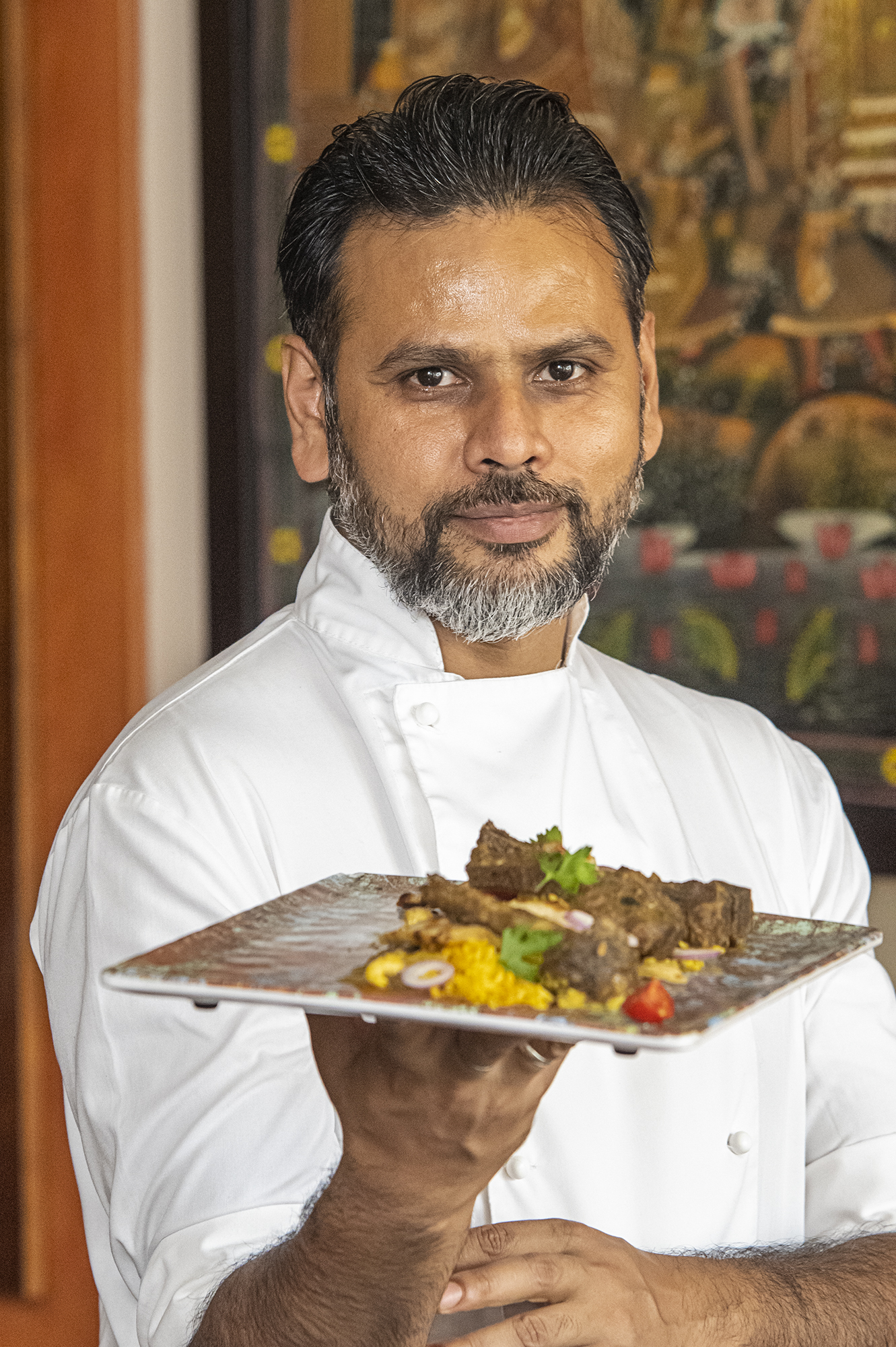 a man holding a plate of food