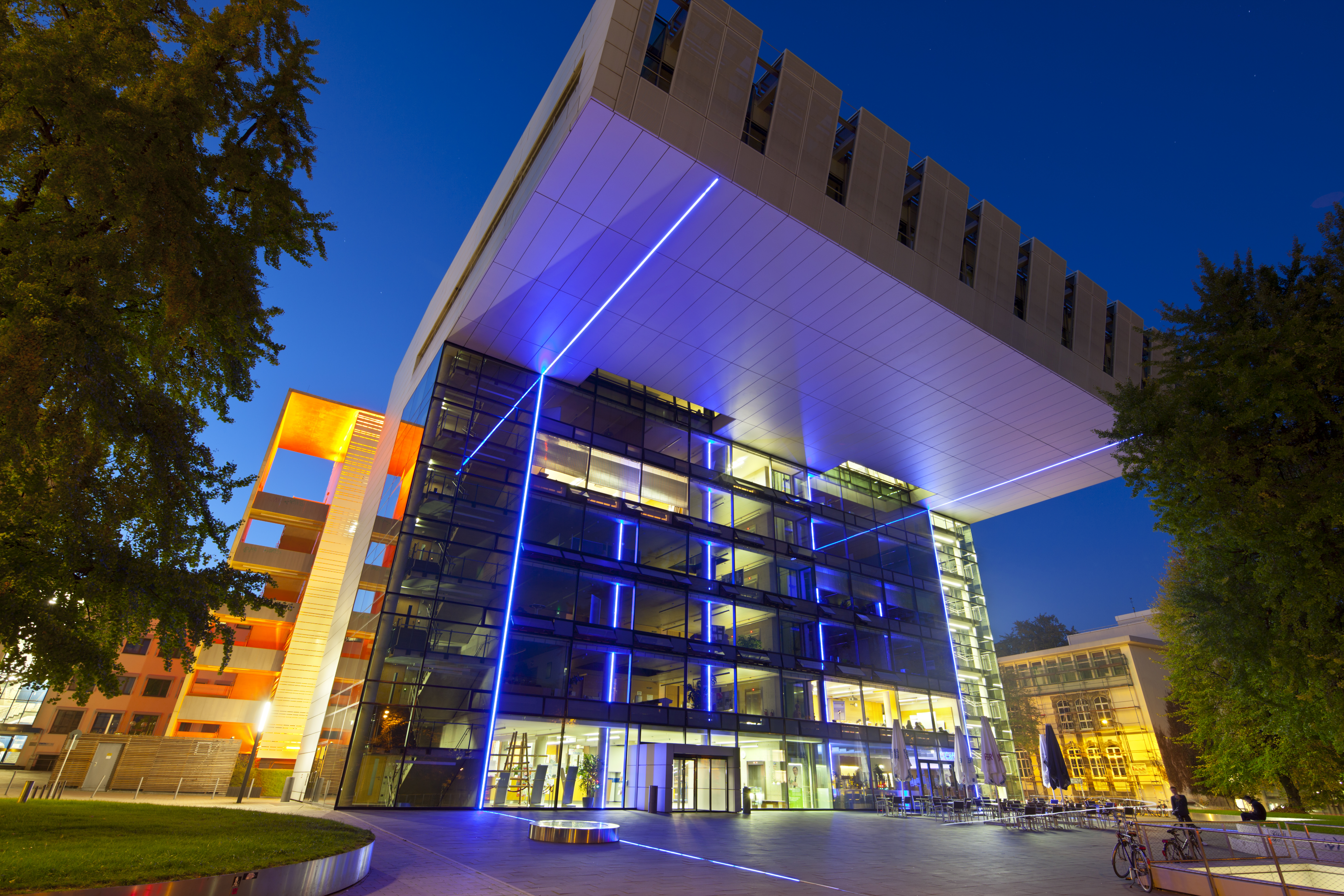 a building with many windows and blue lights