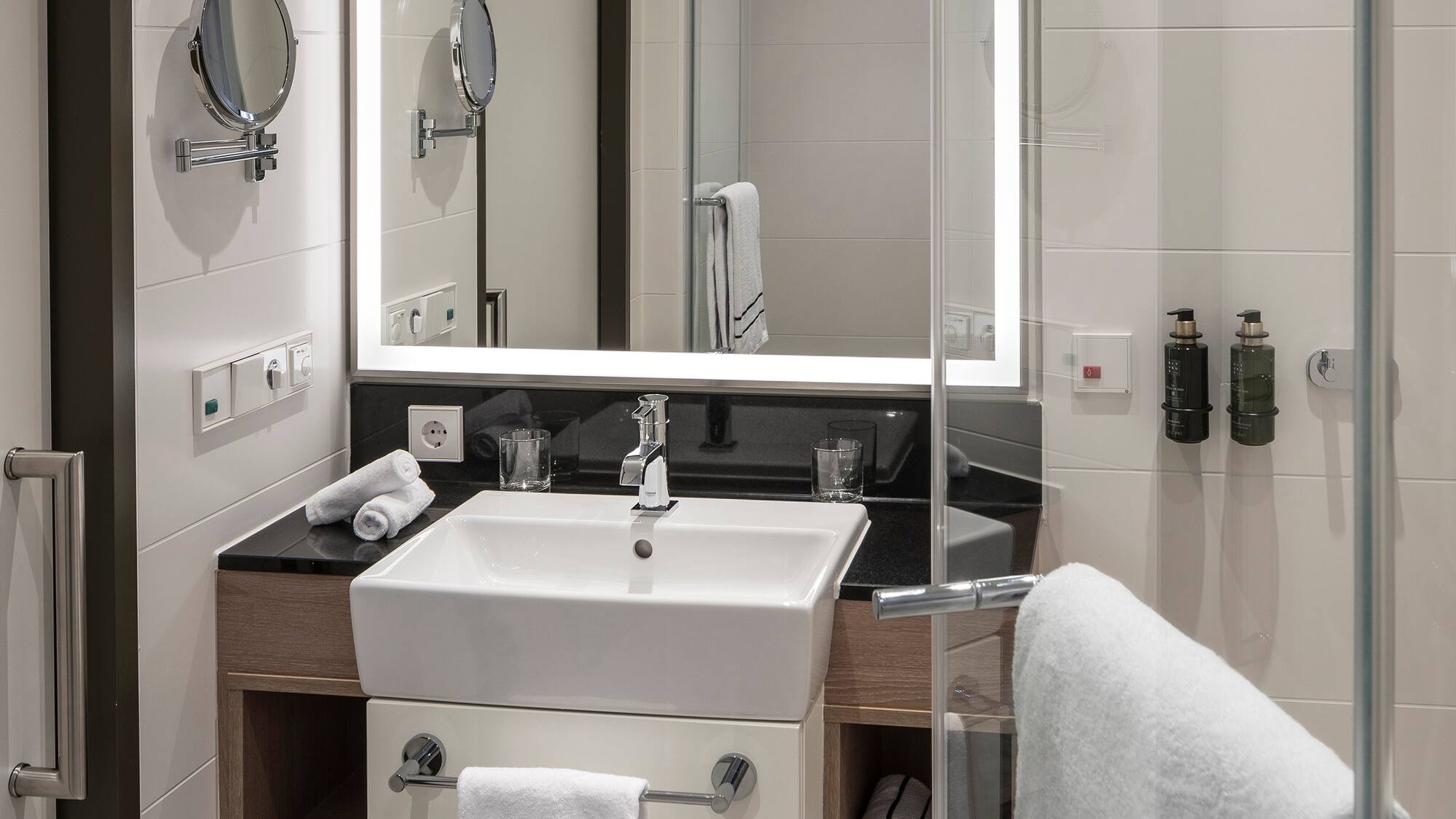 a bathroom with a mirror and sink