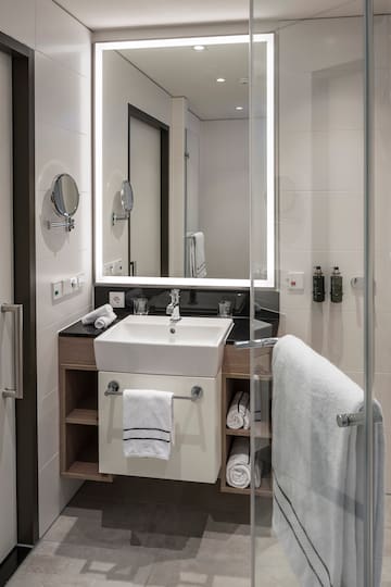 a bathroom with a mirror and sink