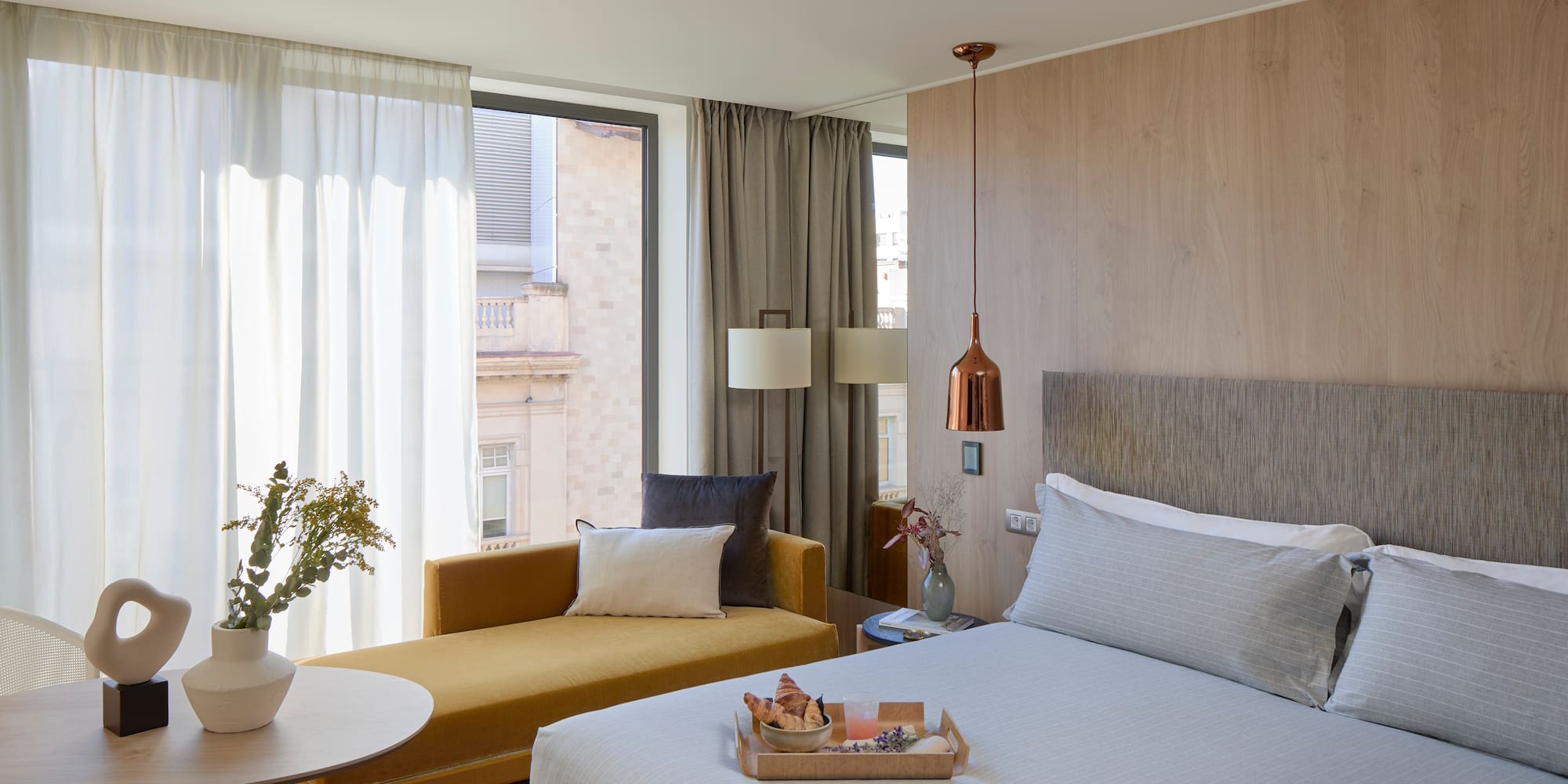 a bedroom with a bed and a couch