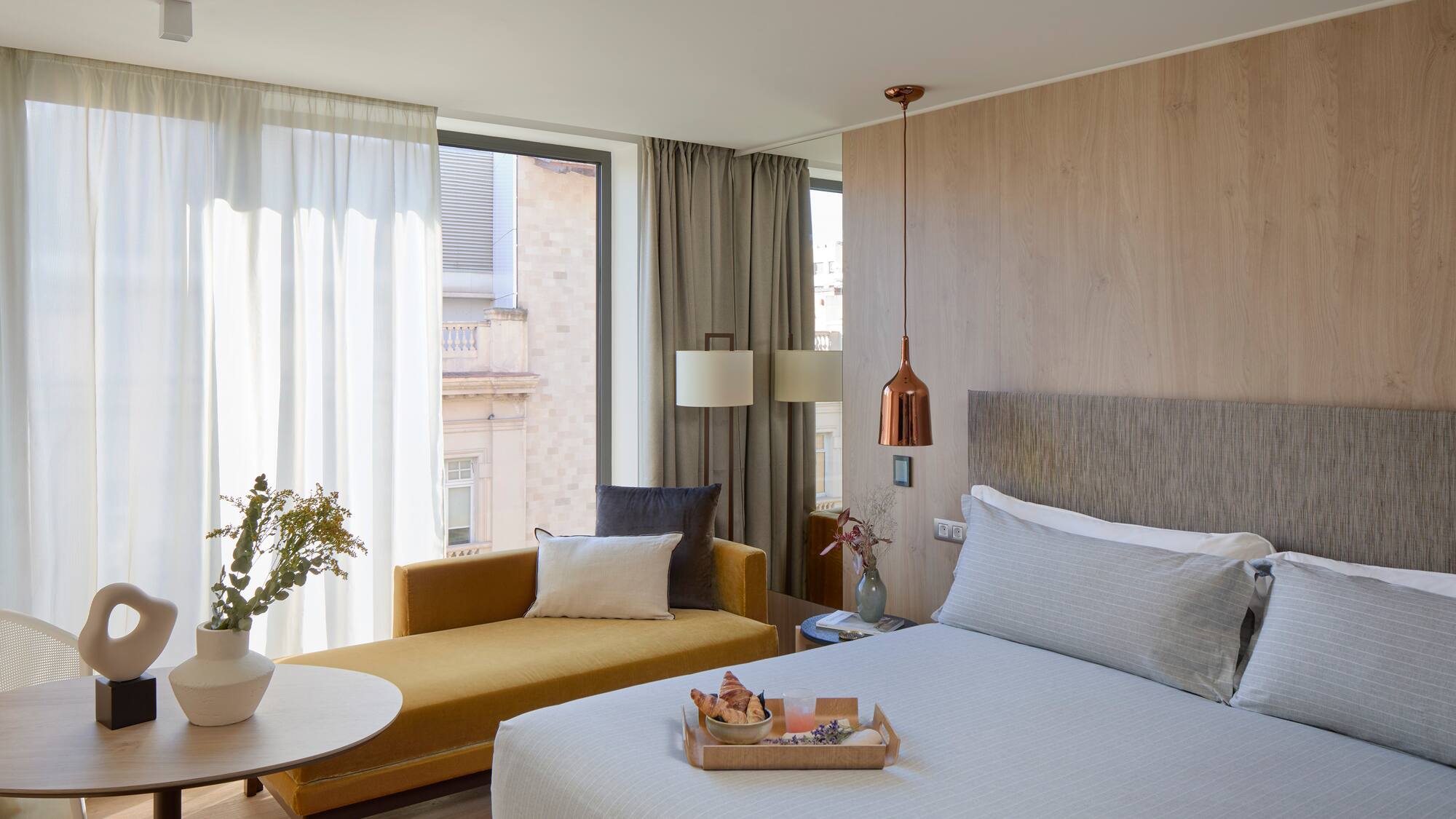 a bedroom with a bed and a couch