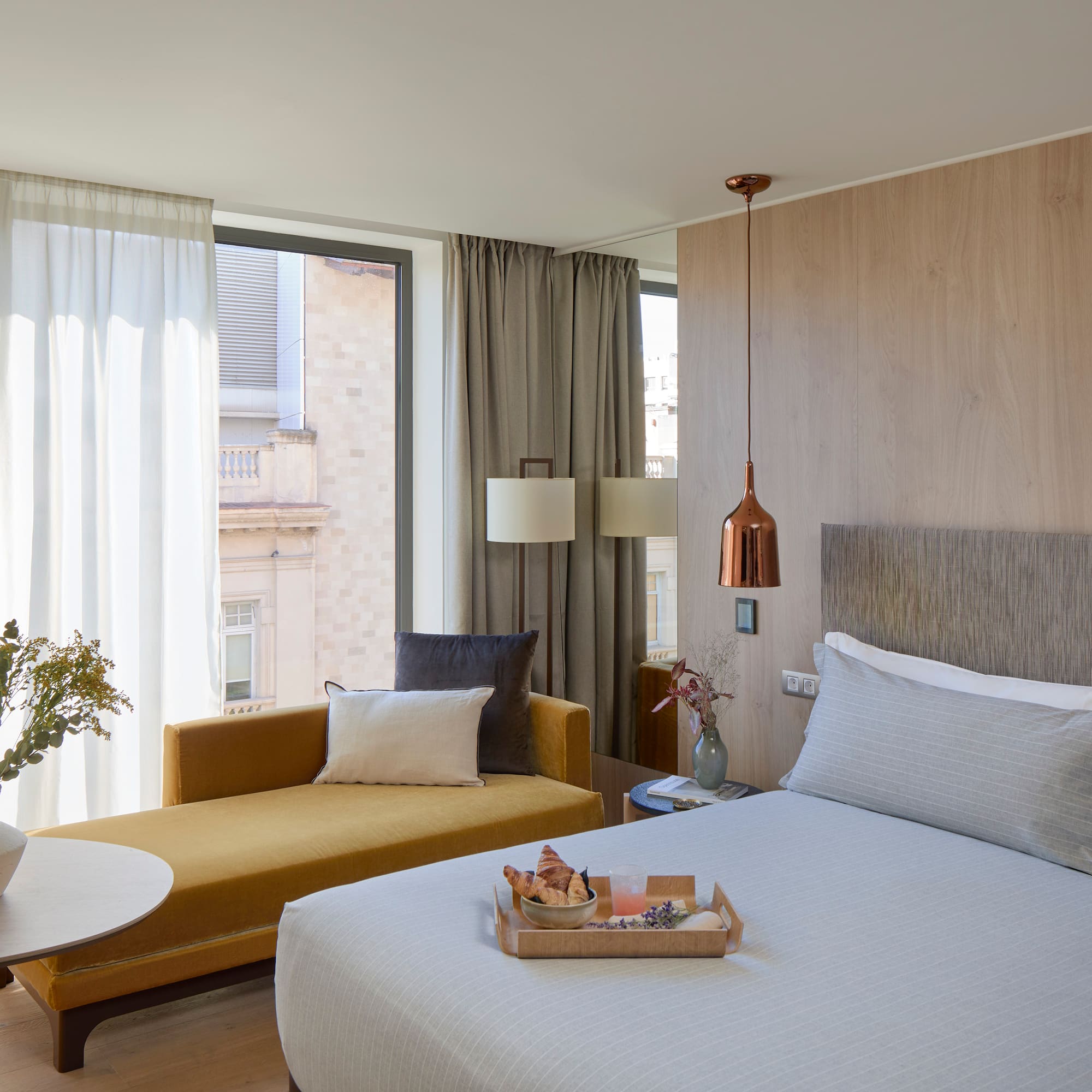 a bedroom with a bed and a couch