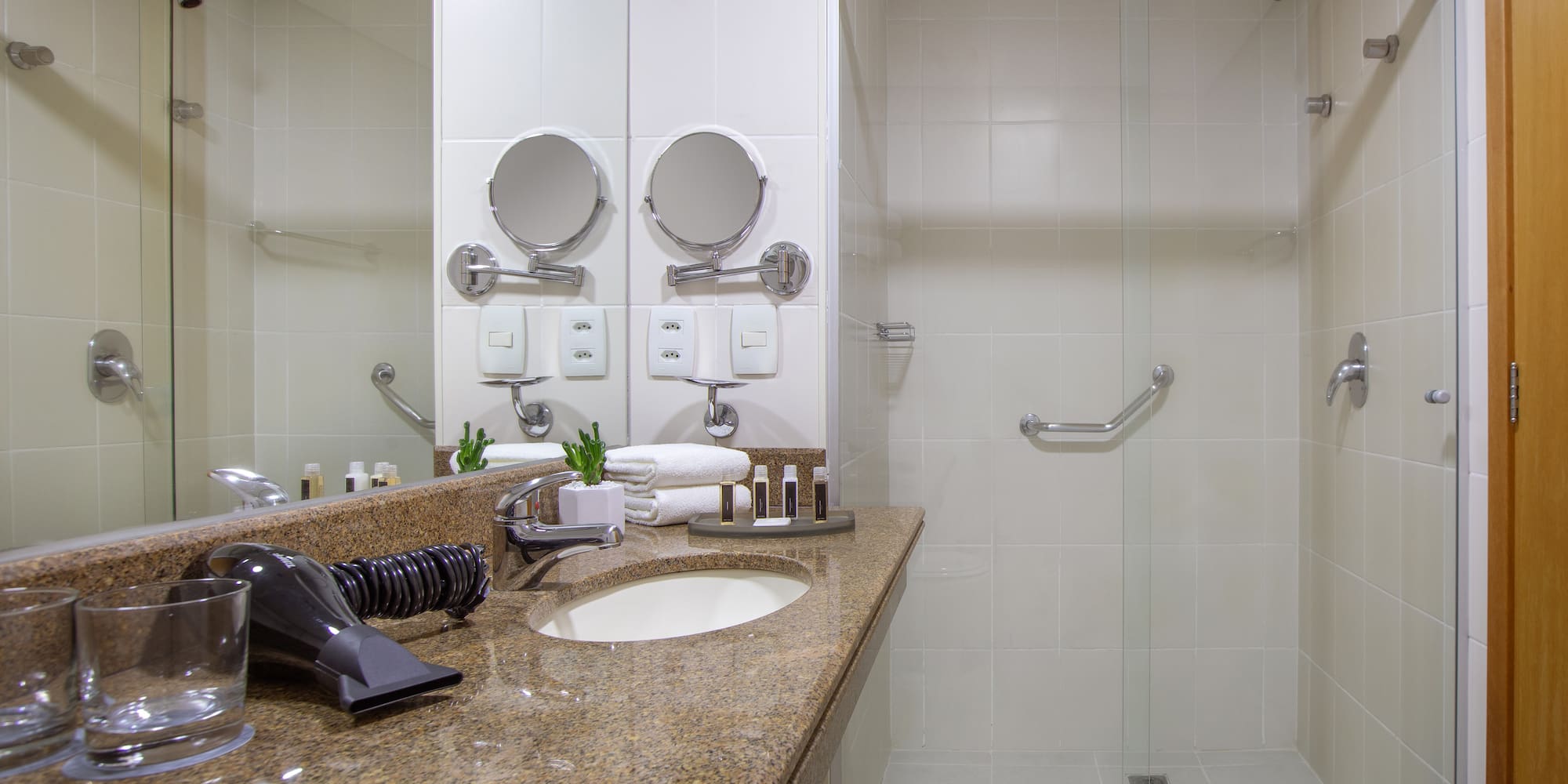 a bathroom with a shower and a sink