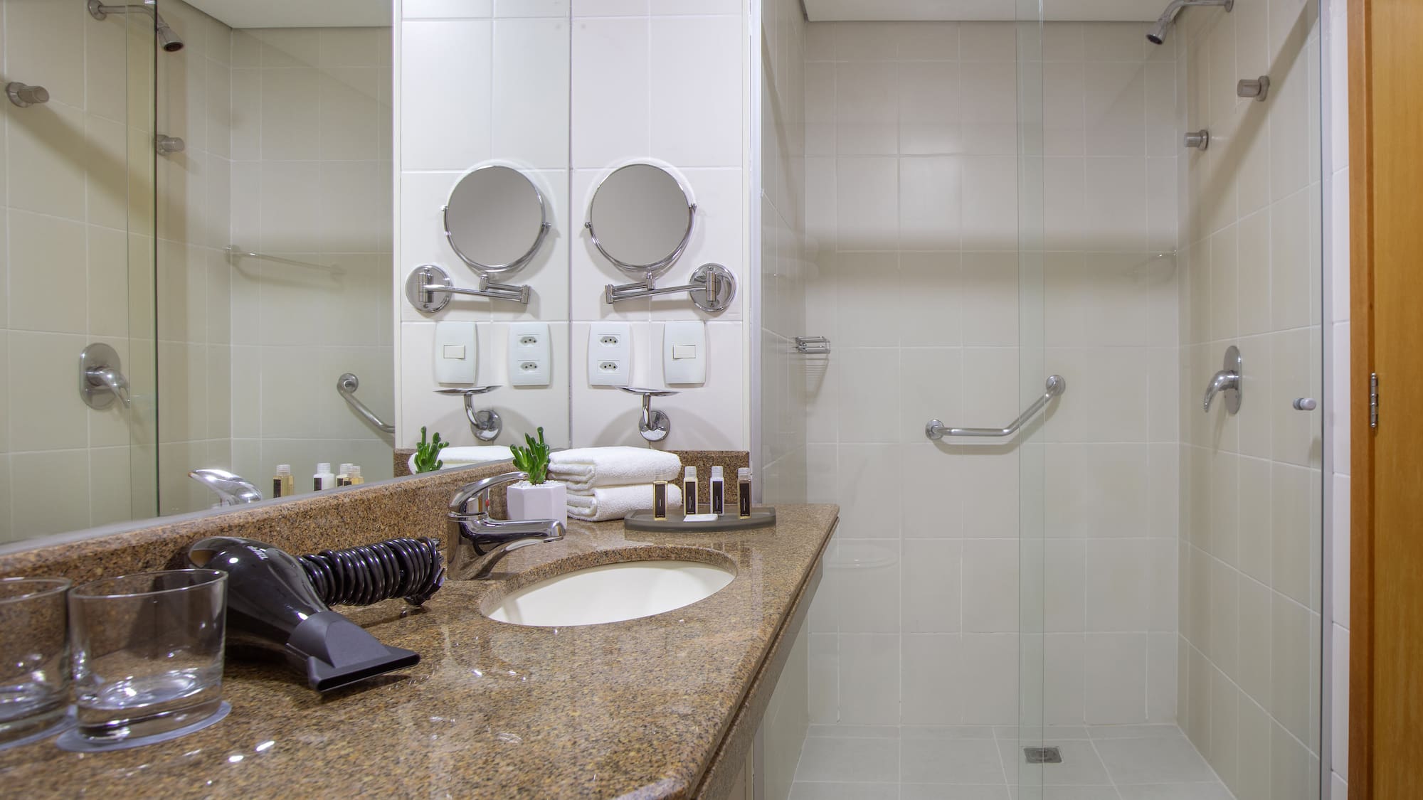 a bathroom with a shower and a sink