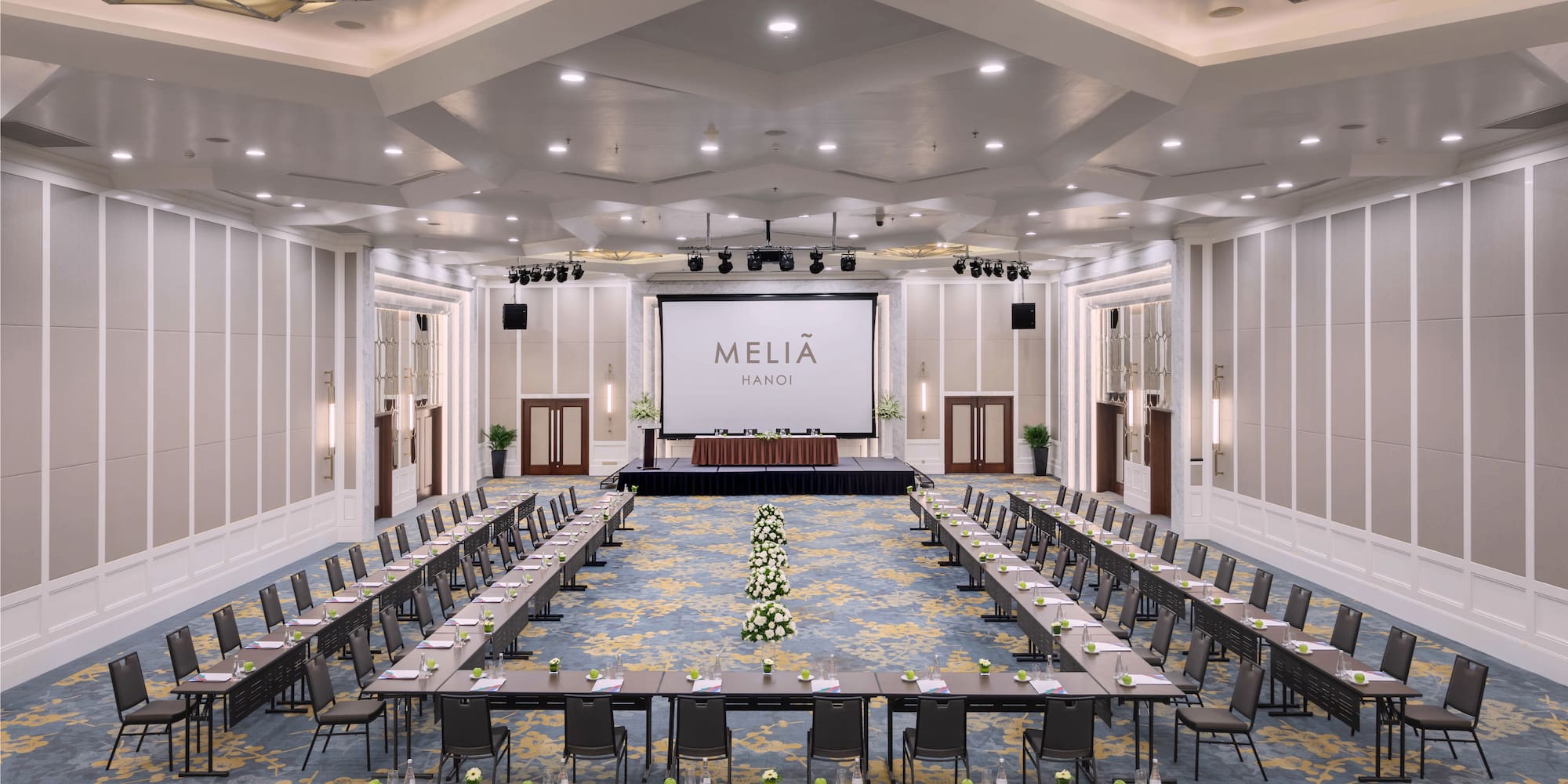 a large room with tables and chairs